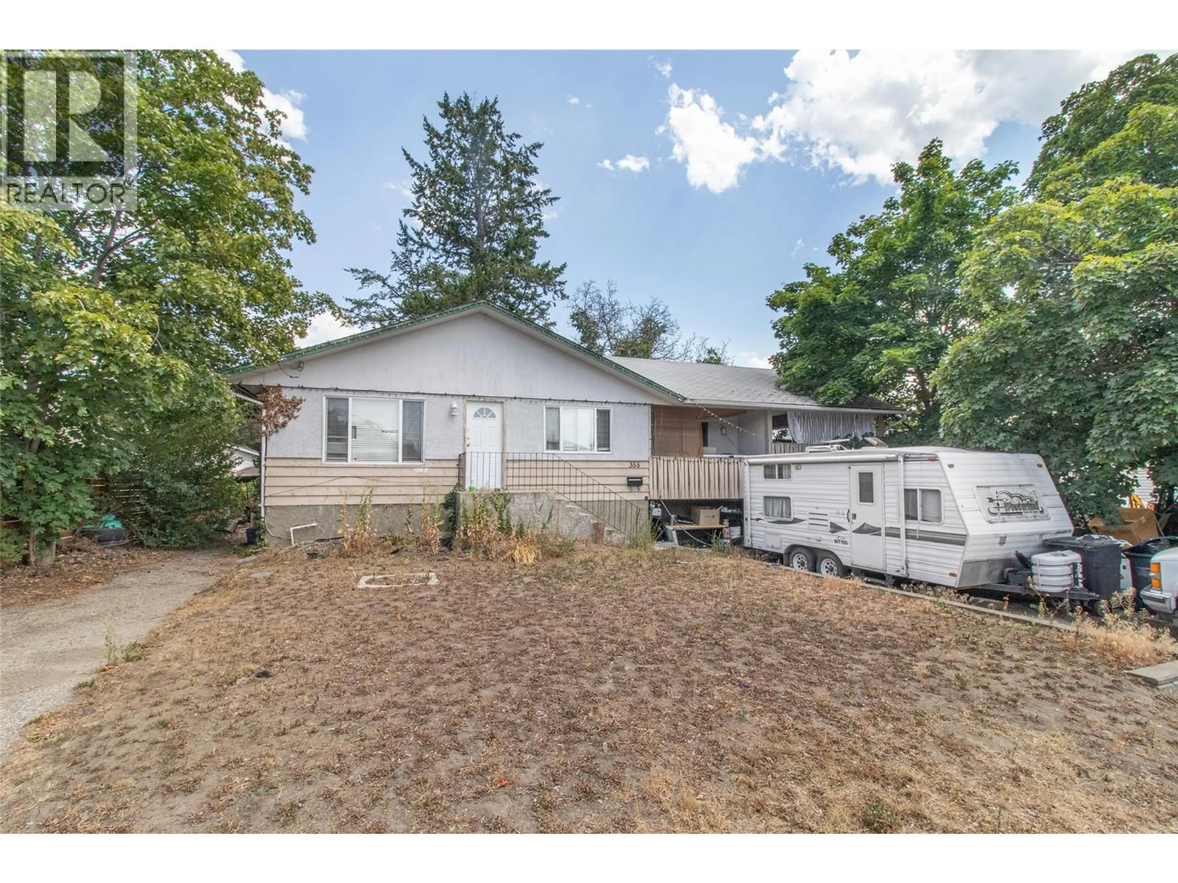 A pic from outside/outdoor area/front of a property/back of a property/a pic from drone, street for 355 DAVIE ROAD, Kelowna British Columbia V1X3Y9