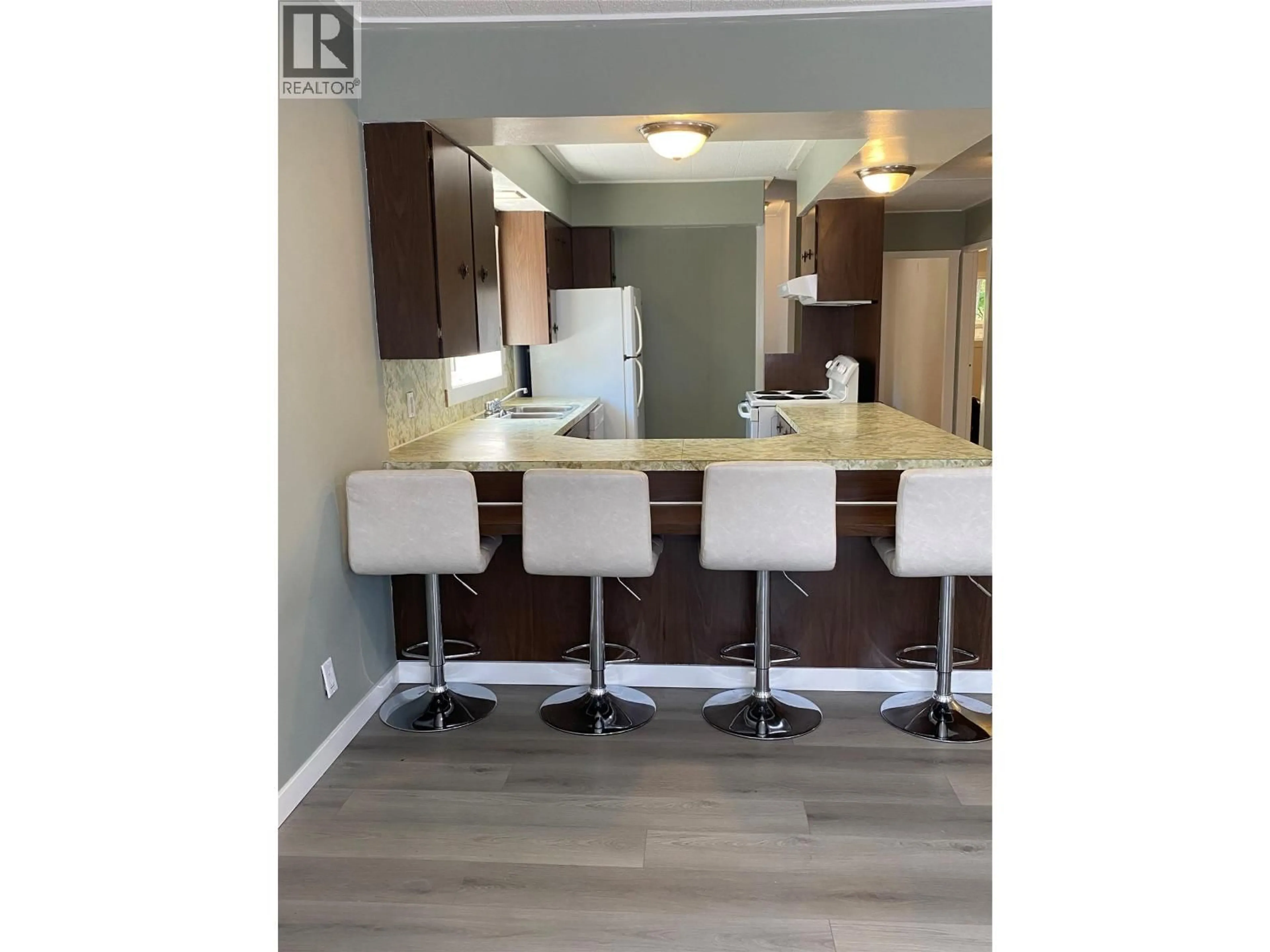 Open concept kitchen, wood/laminate floor for 1338 COLUMBIA AVENUE, Trail British Columbia V1R1J6