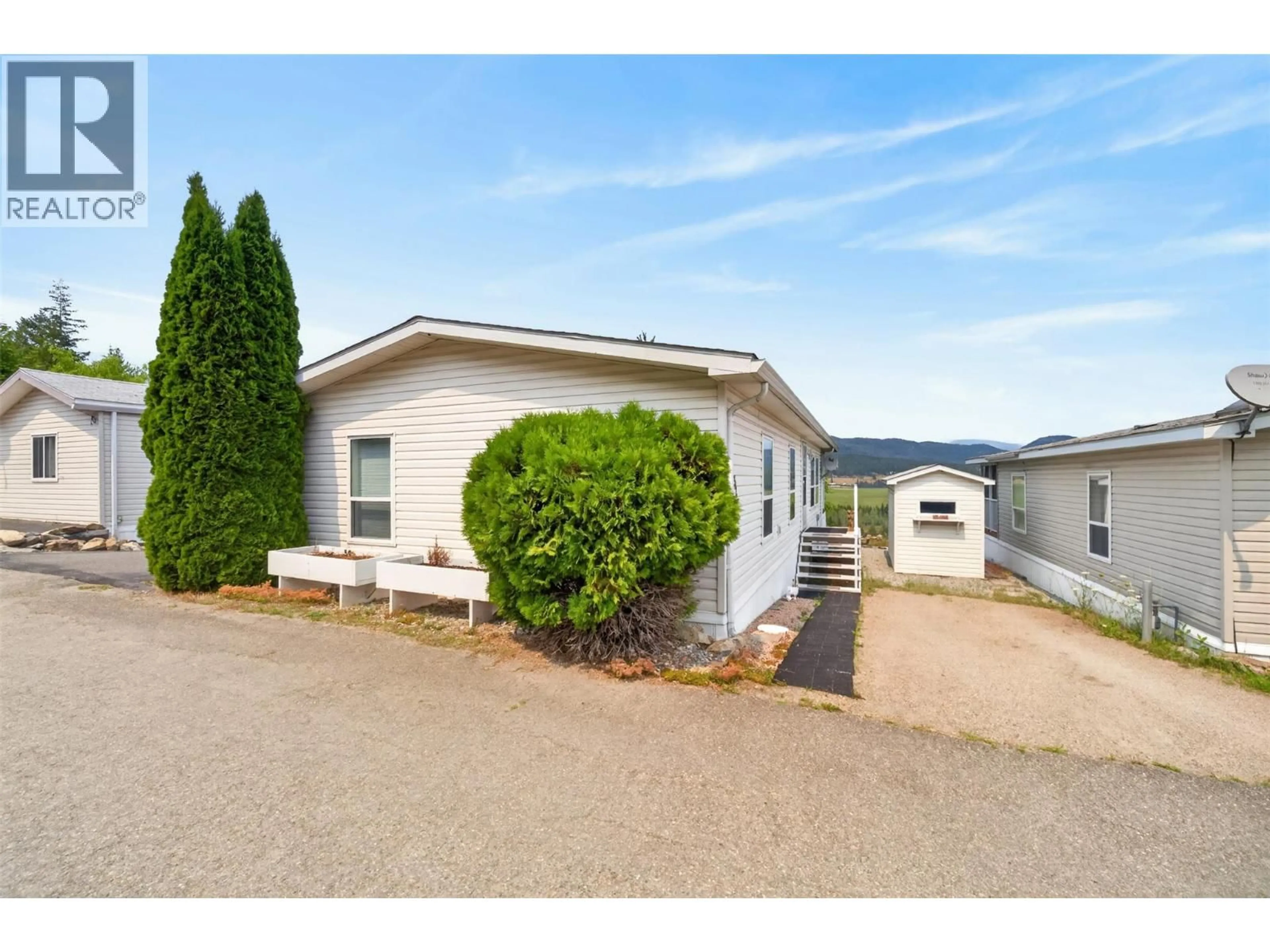 Home with vinyl exterior material, street for 32 - 1885 TAPPEN NOTCH HILL ROAD, Tappen British Columbia V0E2X3