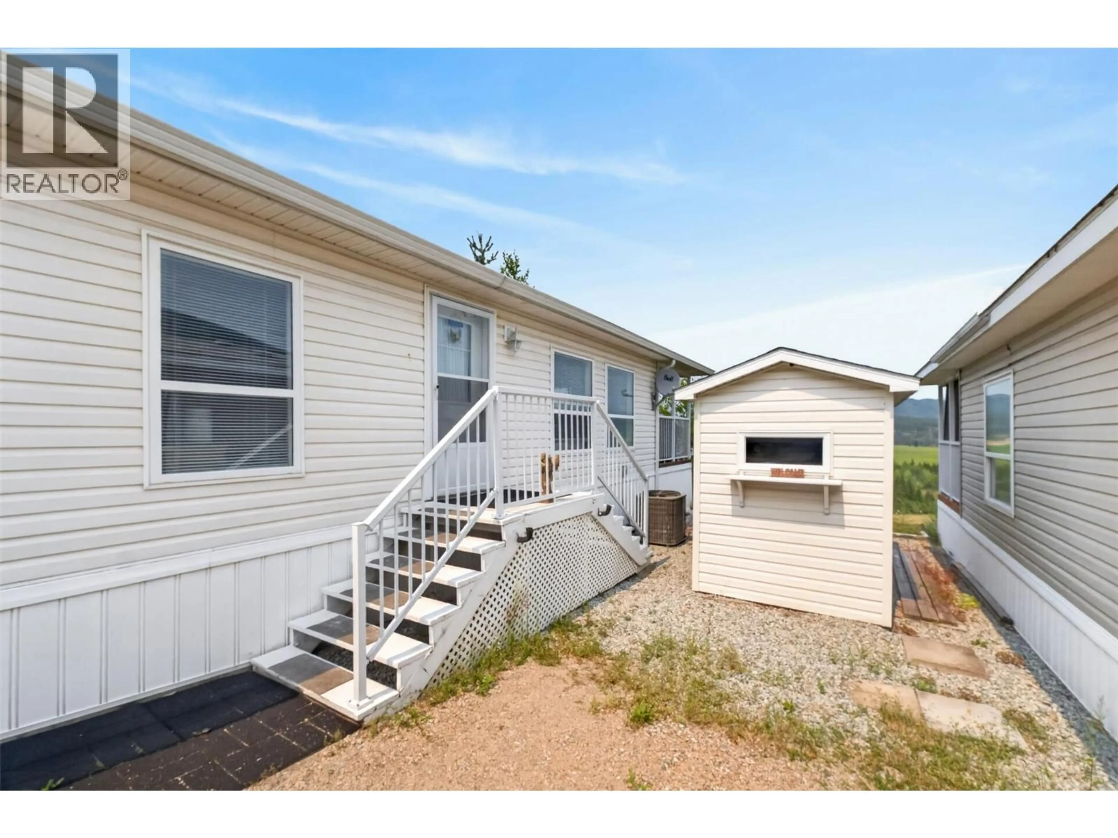 Home with vinyl exterior material, street for 32 - 1885 TAPPEN NOTCH HILL ROAD, Tappen British Columbia V0E2X3