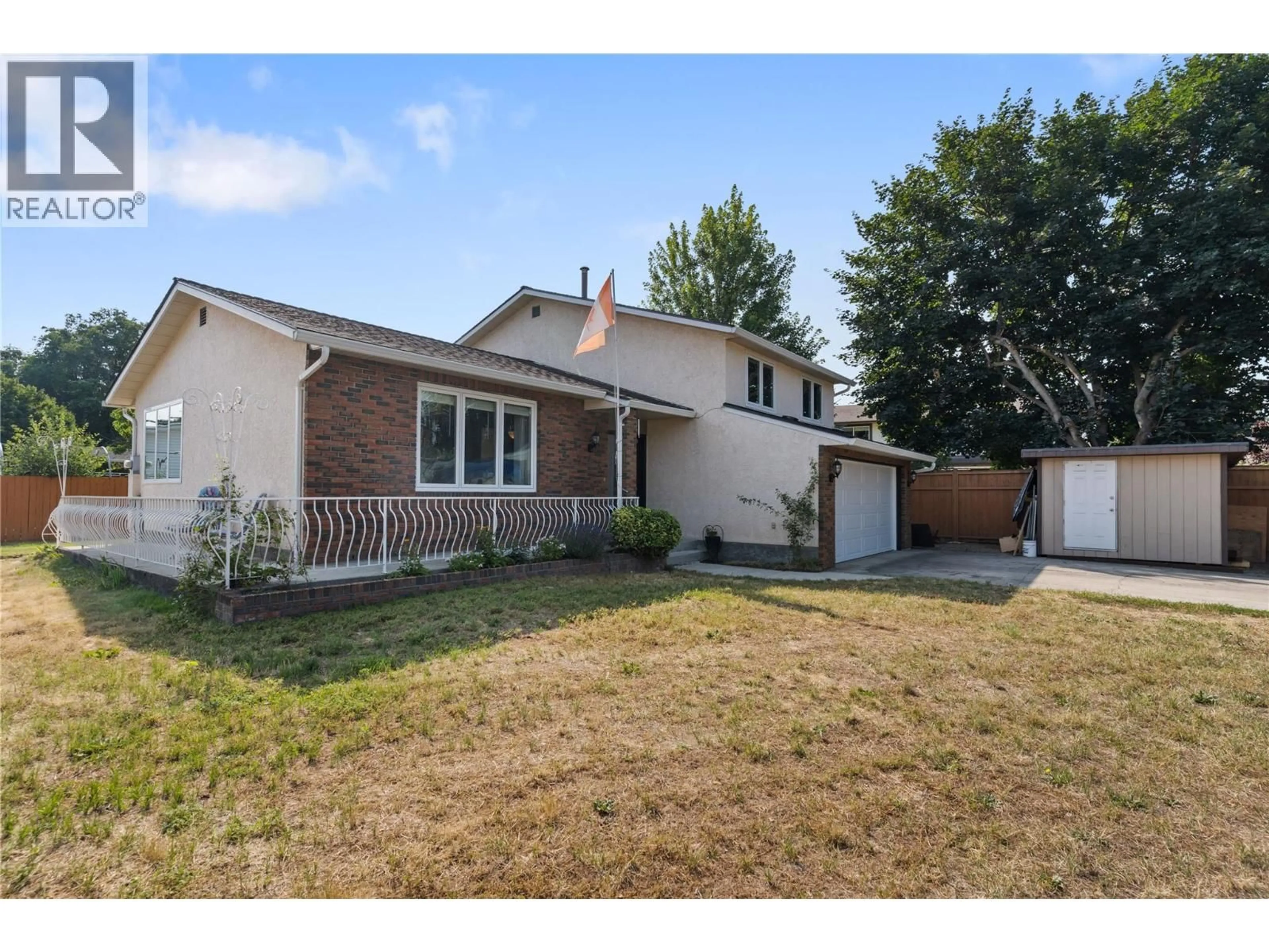 Home with vinyl exterior material, street for 4201 LAKESHORE ROAD, Kelowna British Columbia V1W4H7