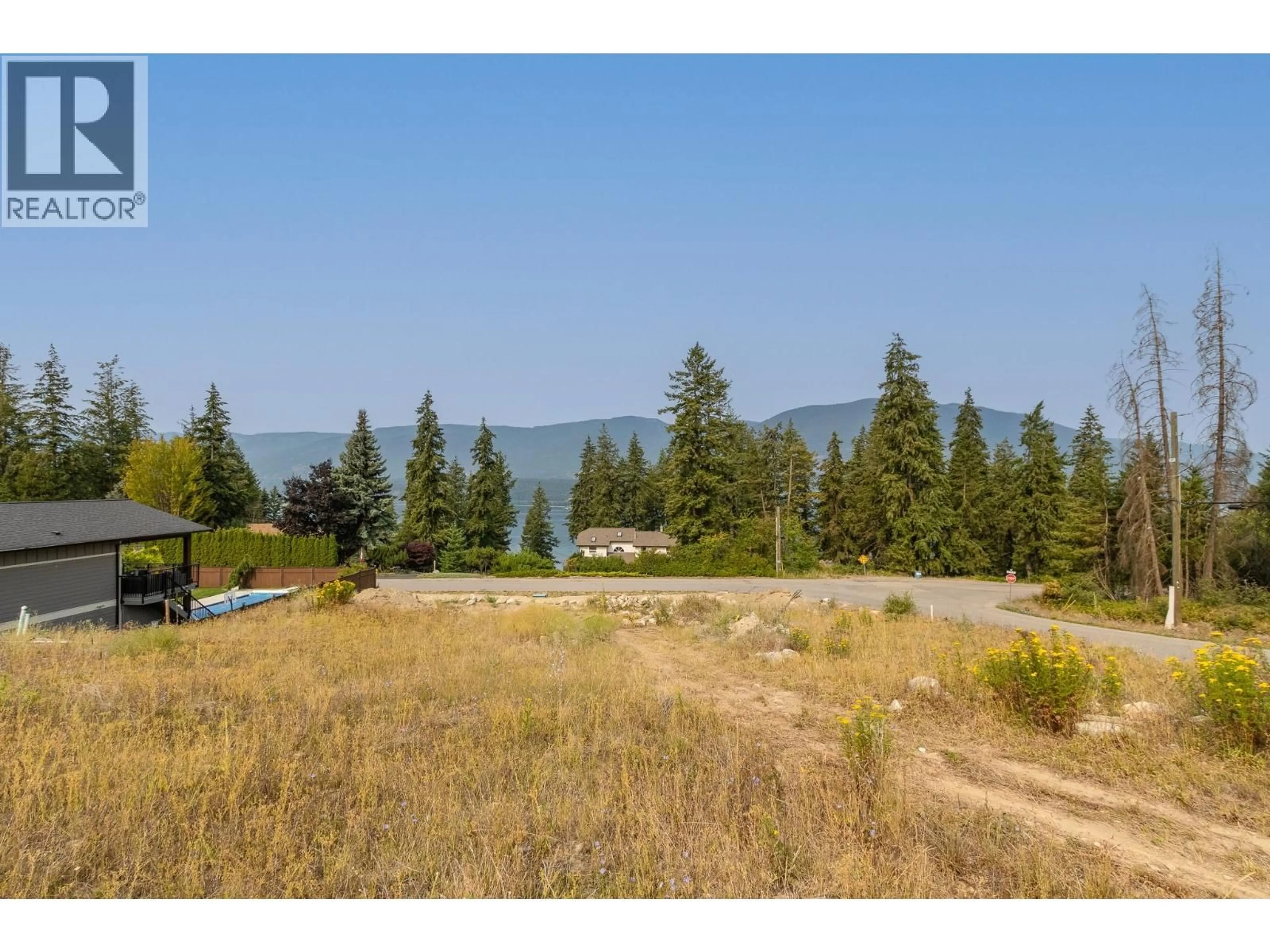 A pic from outside/outdoor area/front of a property/back of a property/a pic from drone, water/lake/river/ocean view for 2000 45 AVENUE NORTHEAST, Salmon Arm British Columbia V1E2E3