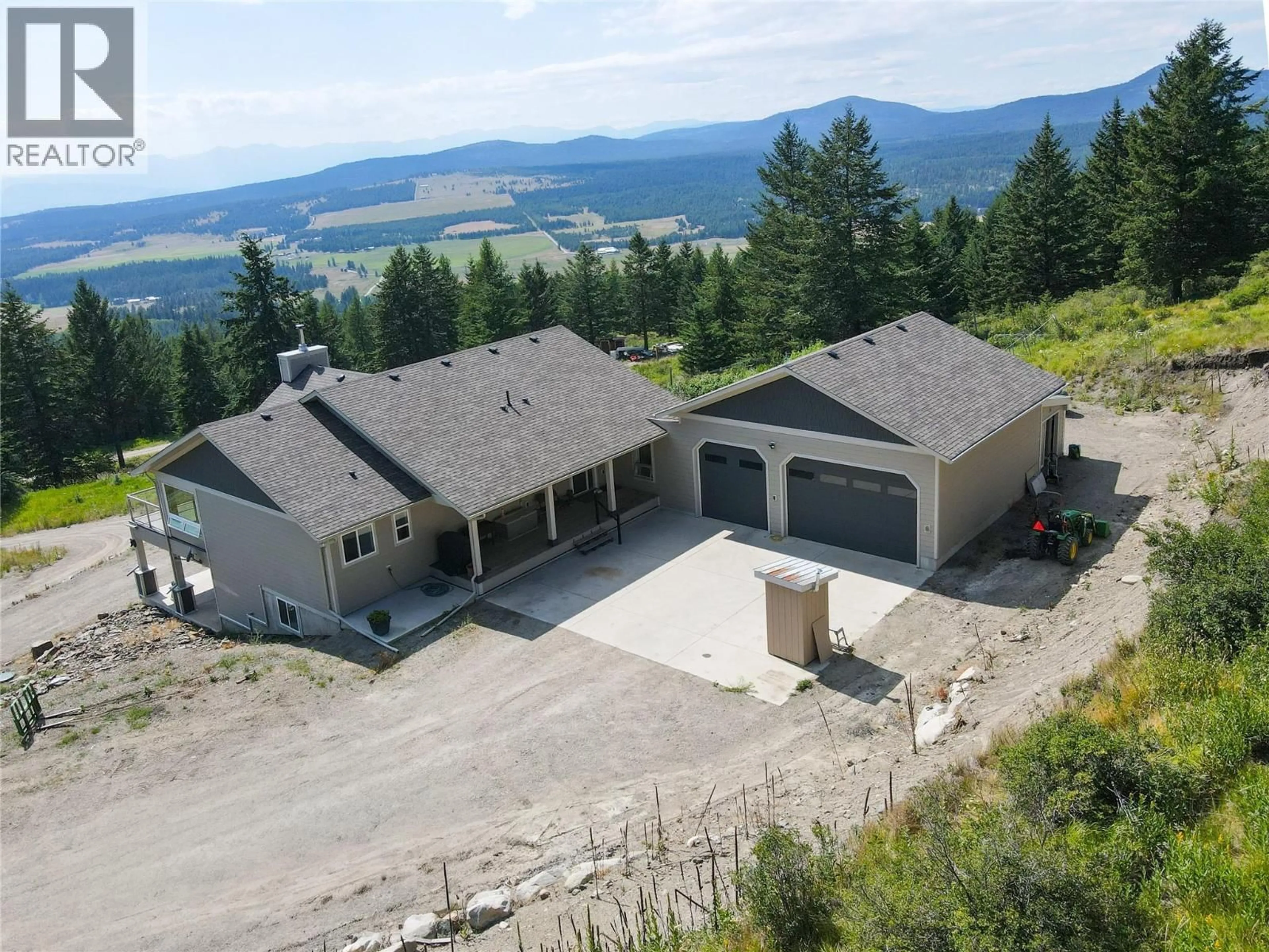 A pic from outside/outdoor area/front of a property/back of a property/a pic from drone, mountain view for 1415 WOLF WAY ROAD, Bridesville British Columbia V0H1Y0