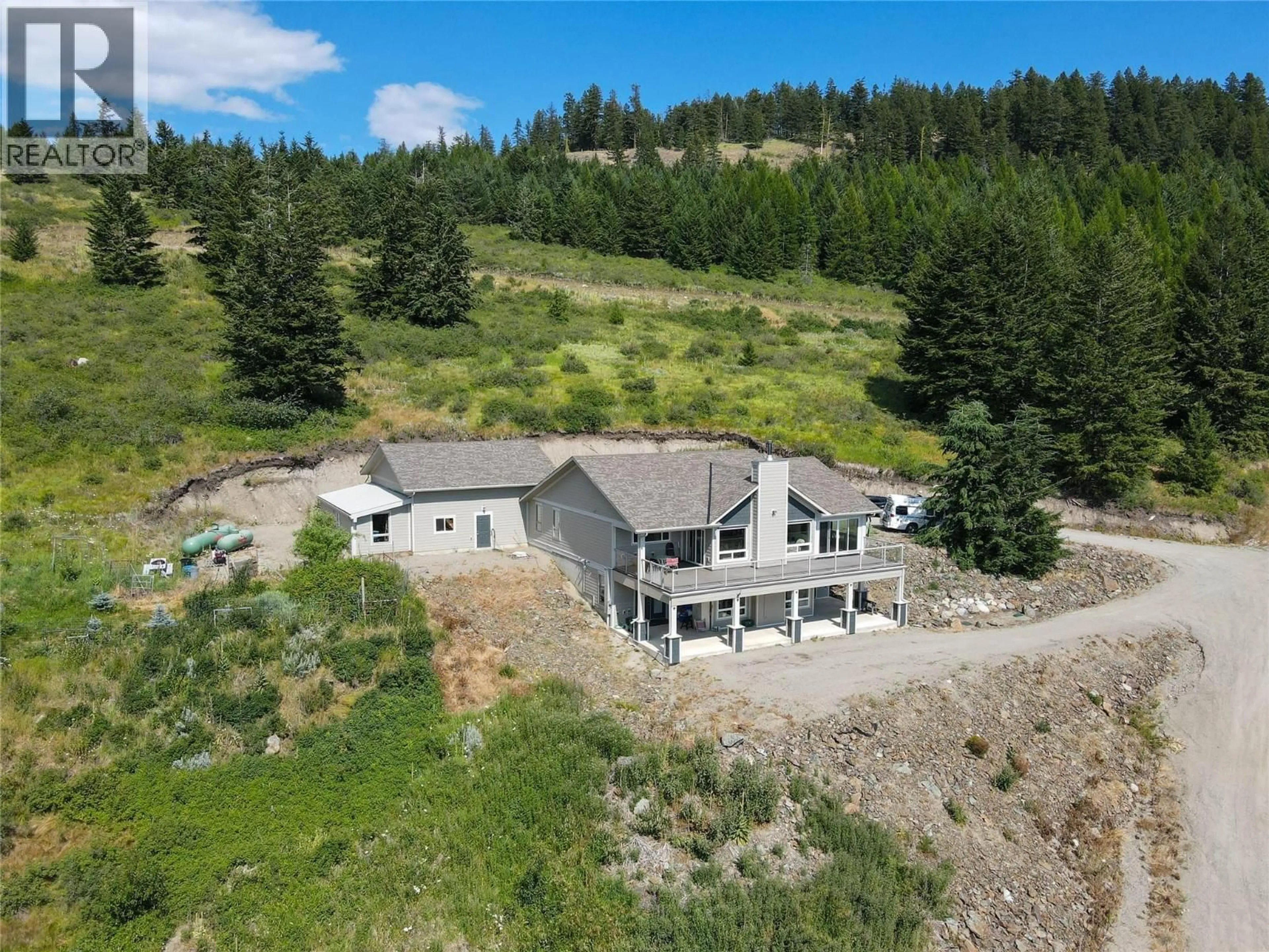 A pic from outside/outdoor area/front of a property/back of a property/a pic from drone, mountain view for 1415 WOLF WAY ROAD, Bridesville British Columbia V0H1Y0