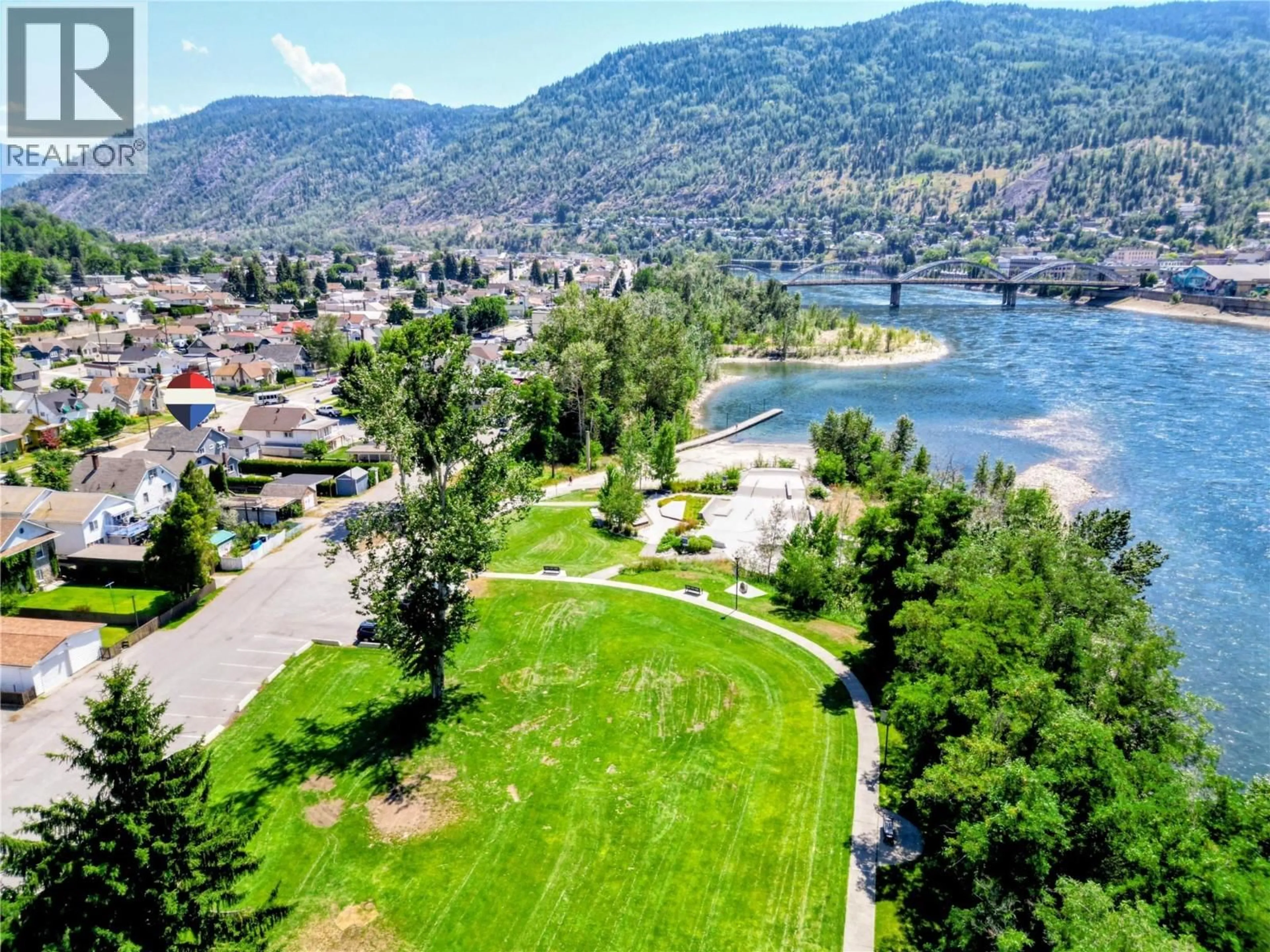 A pic from outside/outdoor area/front of a property/back of a property/a pic from drone, water/lake/river/ocean view for 1188 COLUMBIA AVENUE, Trail British Columbia V1R4L2