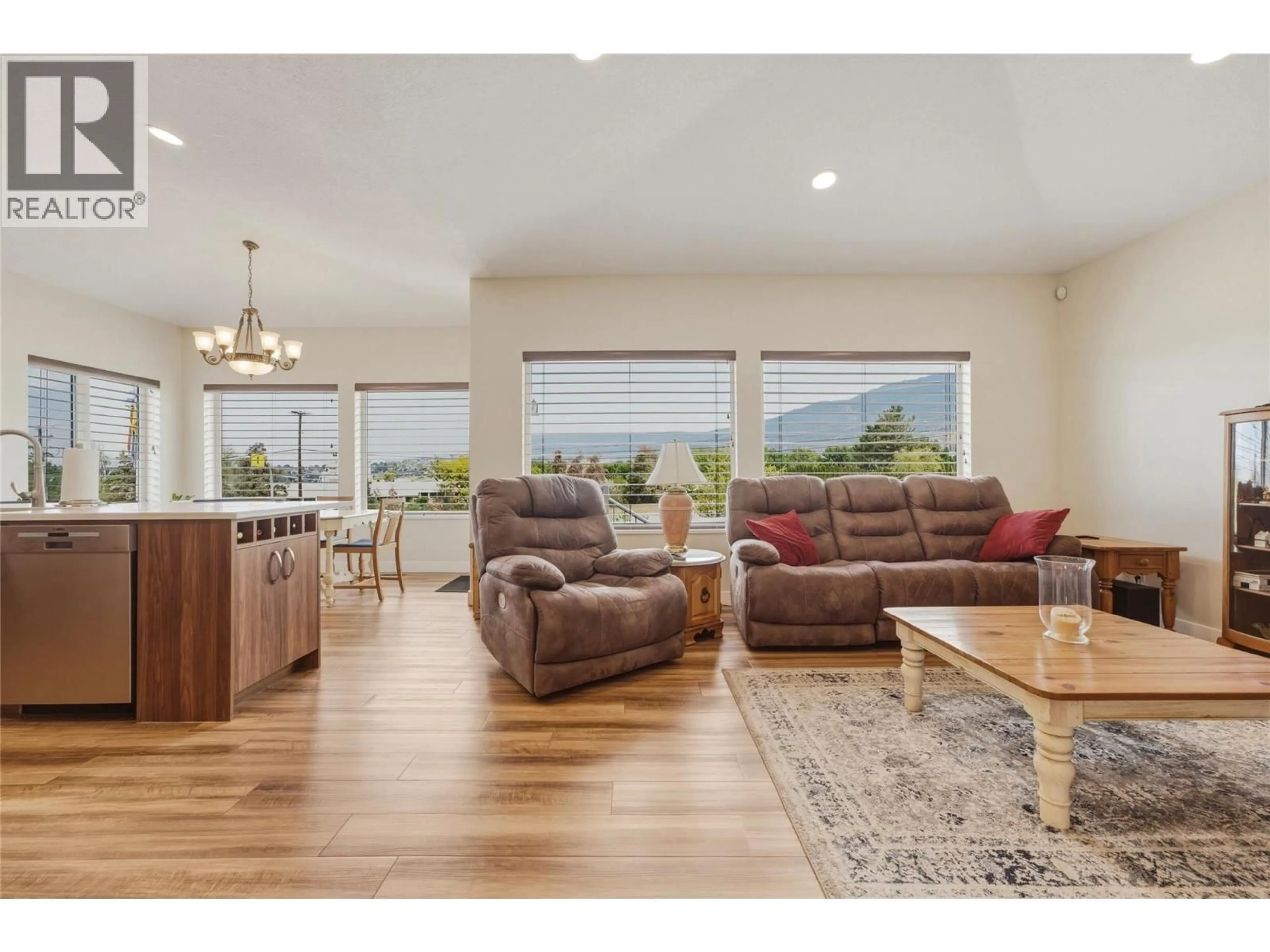 Living room with furniture, wood/laminate floor for 11 - 124 SARSONS ROAD, Vernon British Columbia V1B2T9