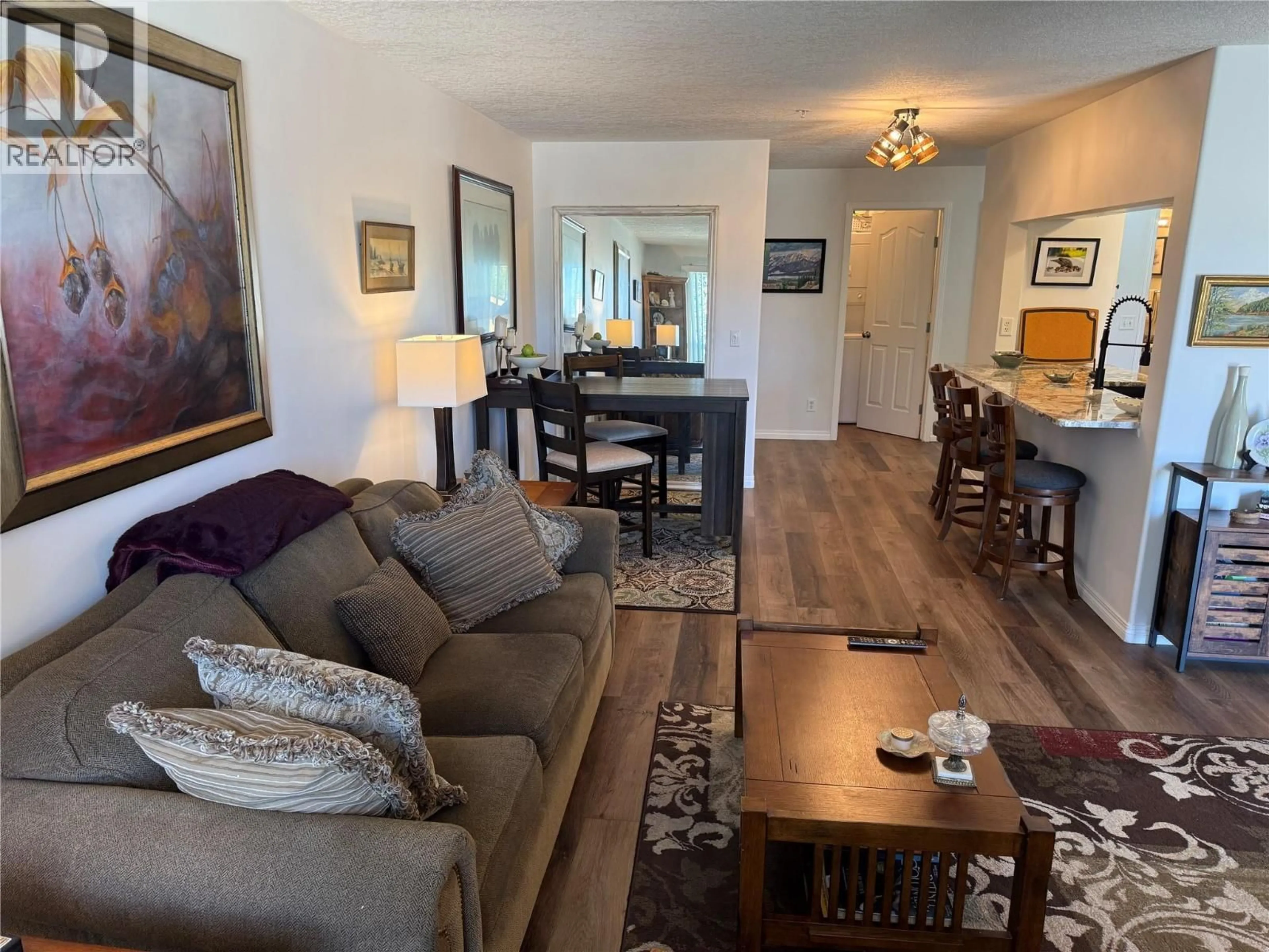 Living room with furniture, wood/laminate floor for 215 - 4769 FORSTERS LANDING ROAD, Radium Hot Springs British Columbia V0A1M0