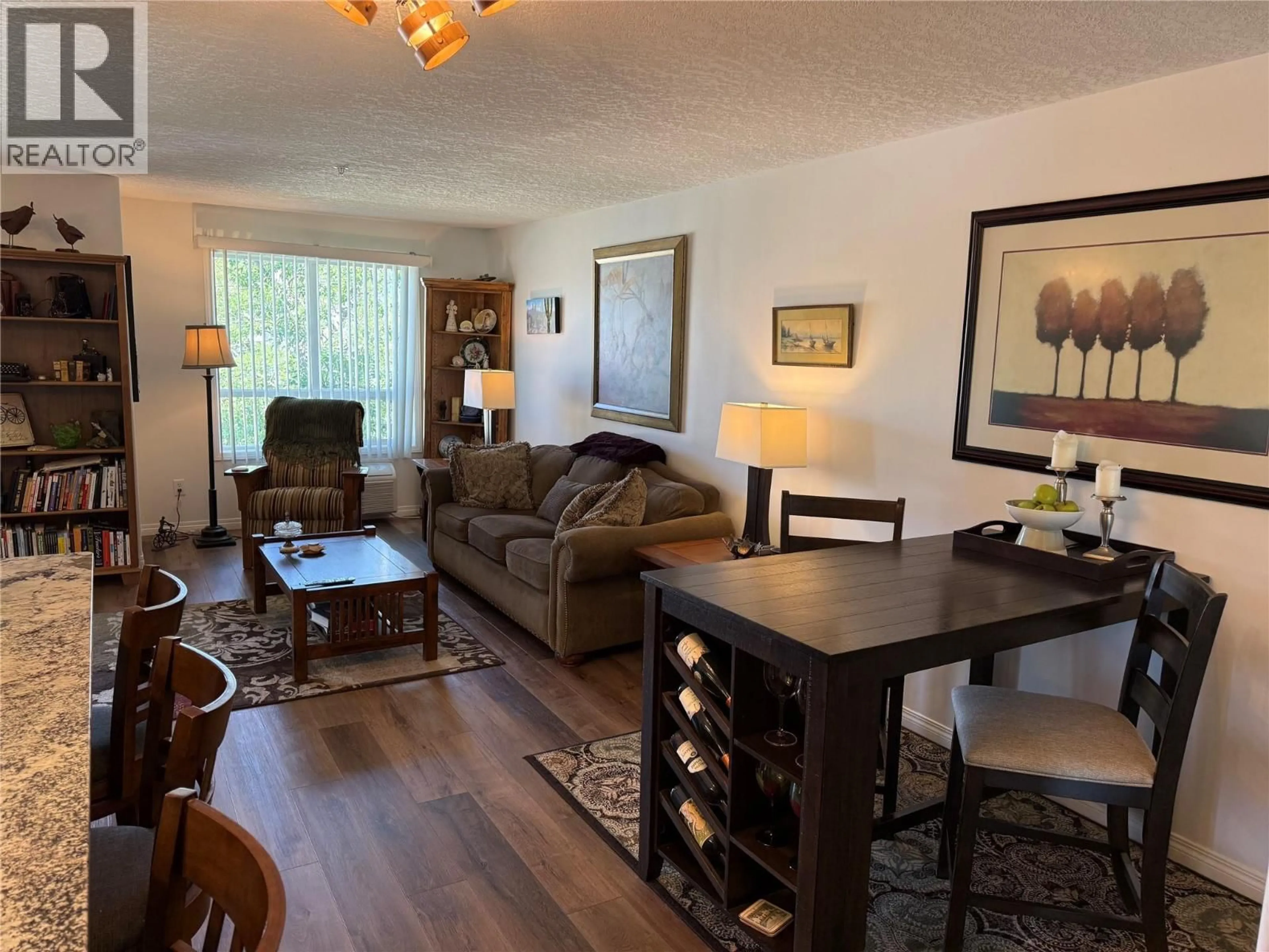 Living room with furniture, wood/laminate floor for 215 - 4769 FORSTERS LANDING ROAD, Radium Hot Springs British Columbia V0A1M0