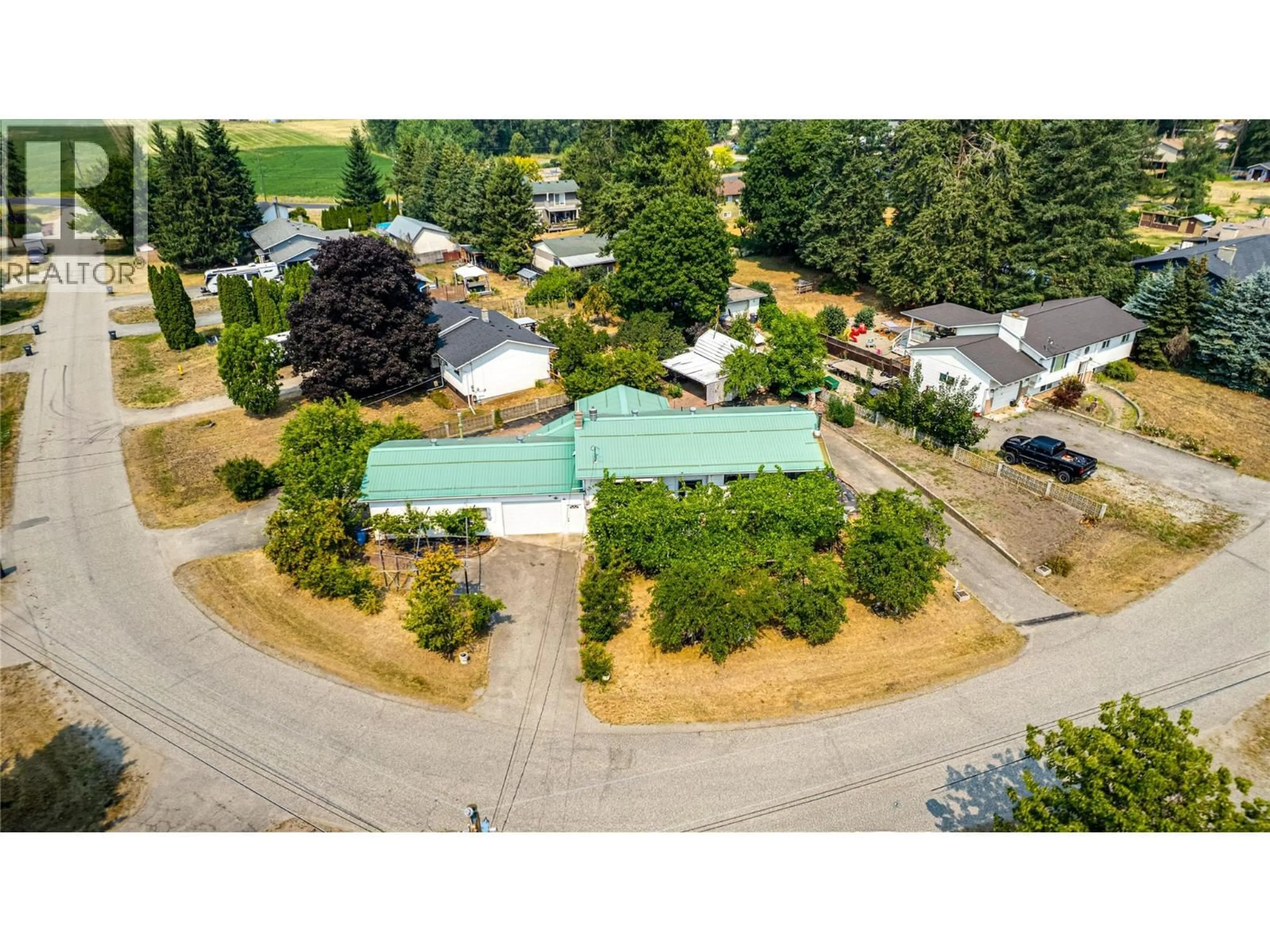 A pic from outside/outdoor area/front of a property/back of a property/a pic from drone, street for 3472 LOCKHART CRESCENT, Spallumcheen British Columbia V4Y0S9