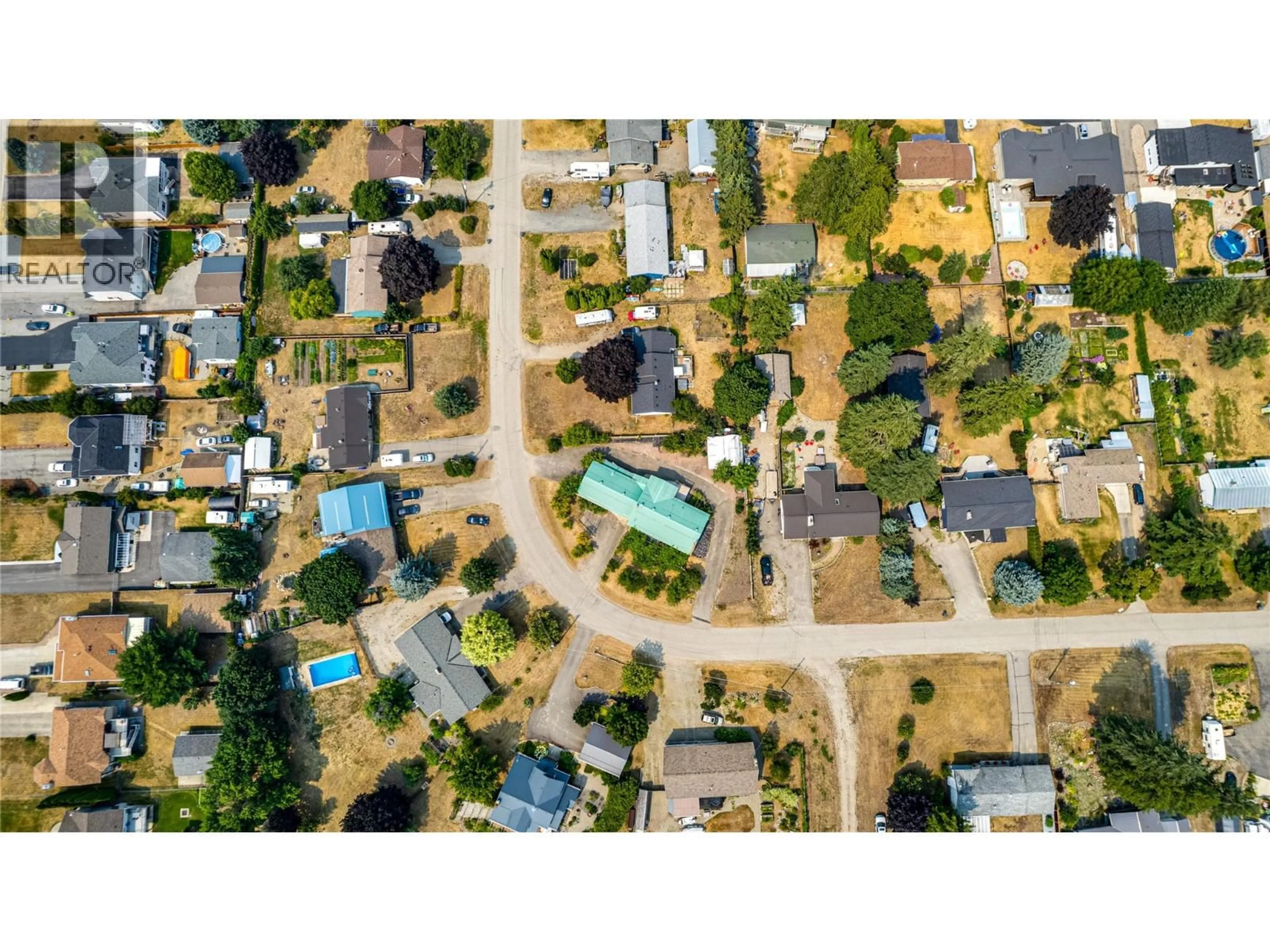 A pic from outside/outdoor area/front of a property/back of a property/a pic from drone, street for 3472 LOCKHART CRESCENT, Spallumcheen British Columbia V4Y0S9