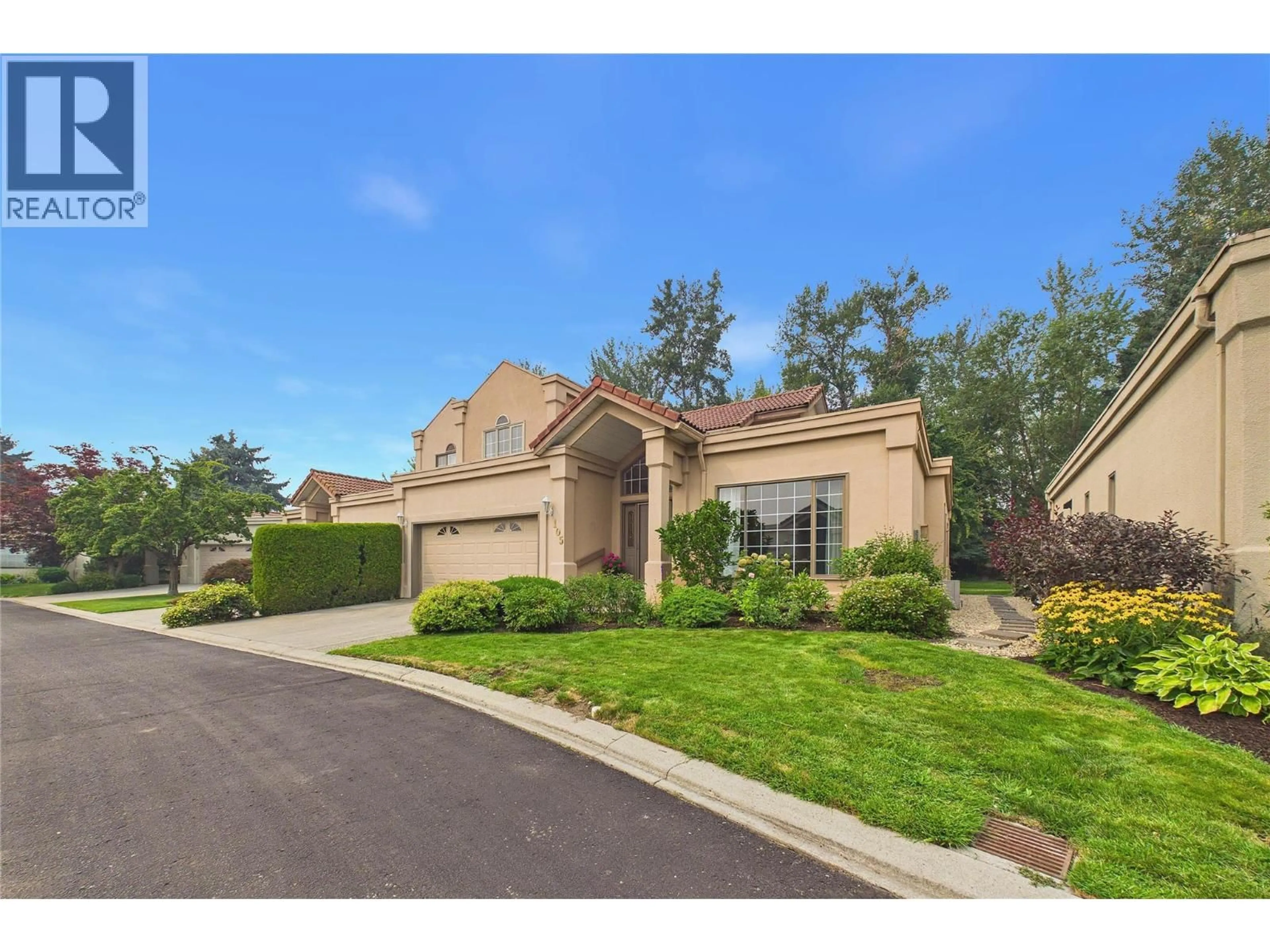 A pic from outside/outdoor area/front of a property/back of a property/a pic from drone, street for 105 - 650 LEXINGTON DRIVE, Kelowna British Columbia V1W3B6