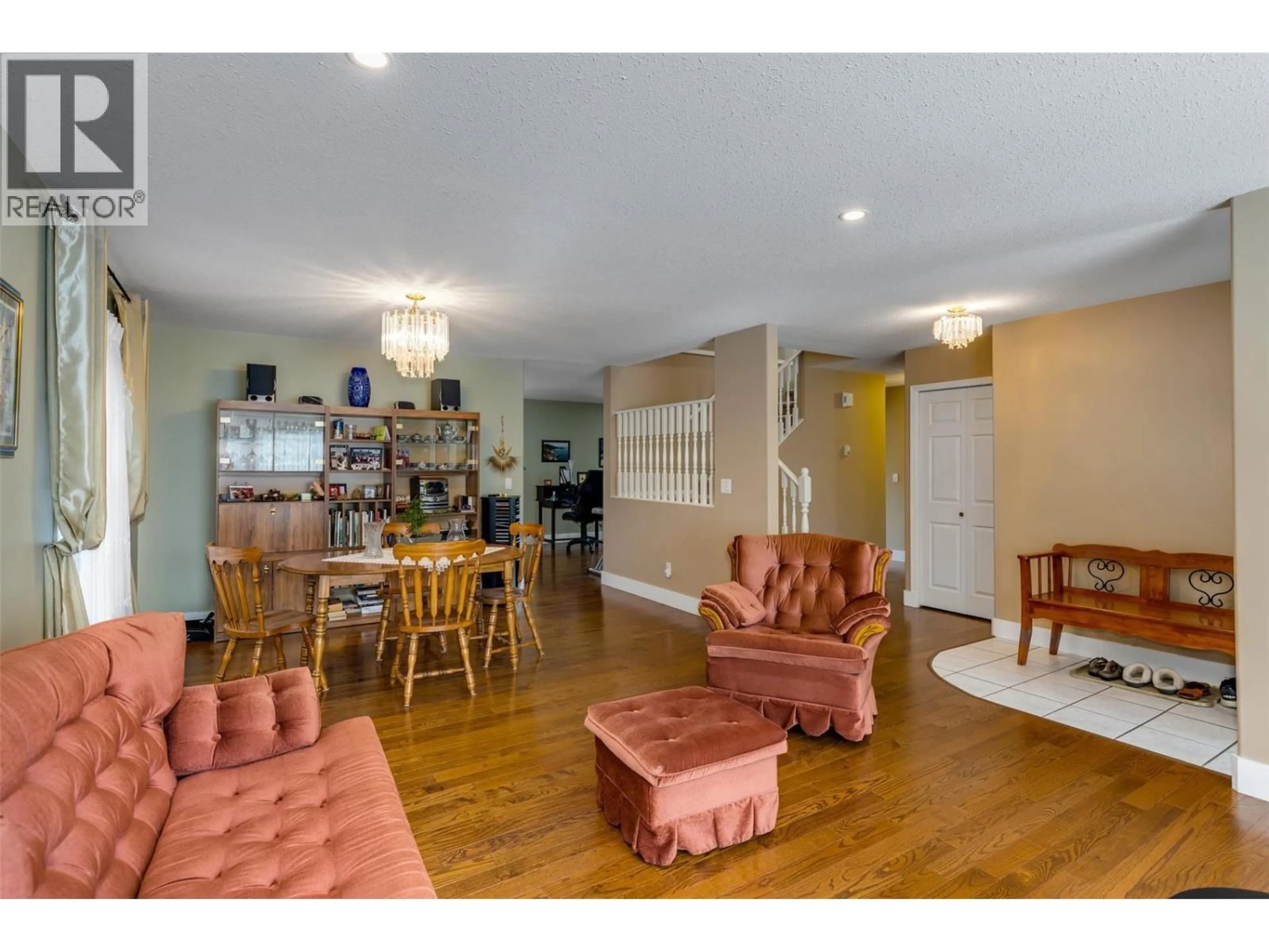 Living room with furniture, wood/laminate floor for 5 - 555 GLENMEADOWS ROAD, Kelowna British Columbia V1V1V5