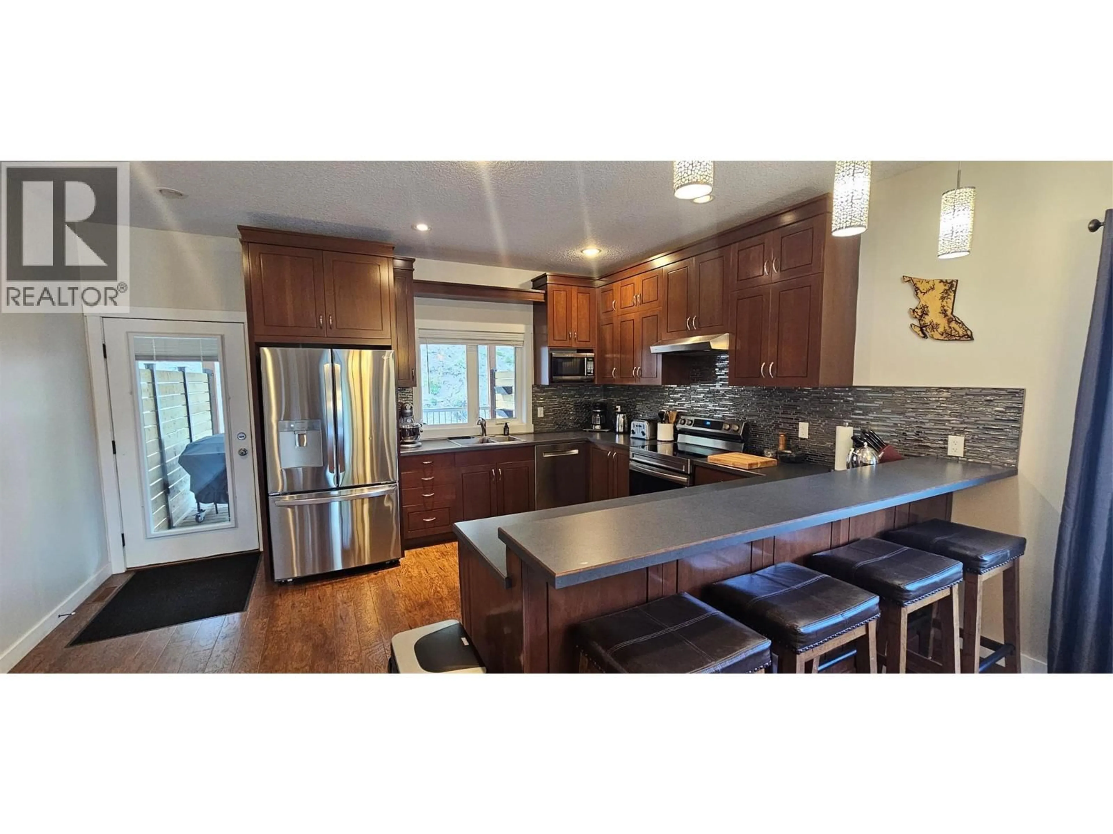 Open concept kitchen, wood/laminate floor for 73 DEERBORNE DRIVE, Elkford British Columbia V0B1H0