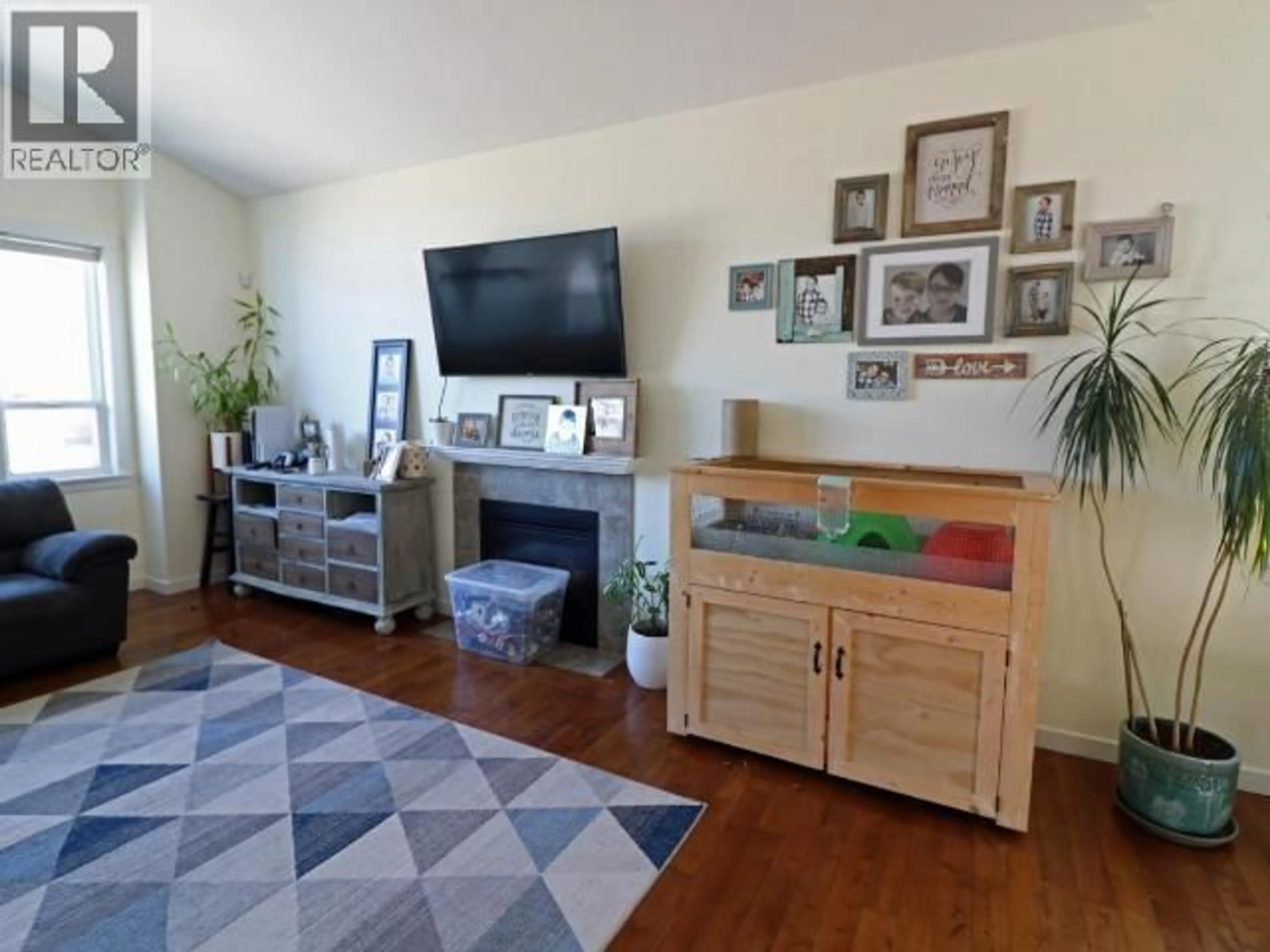 Living room with furniture, wood/laminate floor for 2037 STAGECOACH DRIVE, Kamloops British Columbia V2B0A7