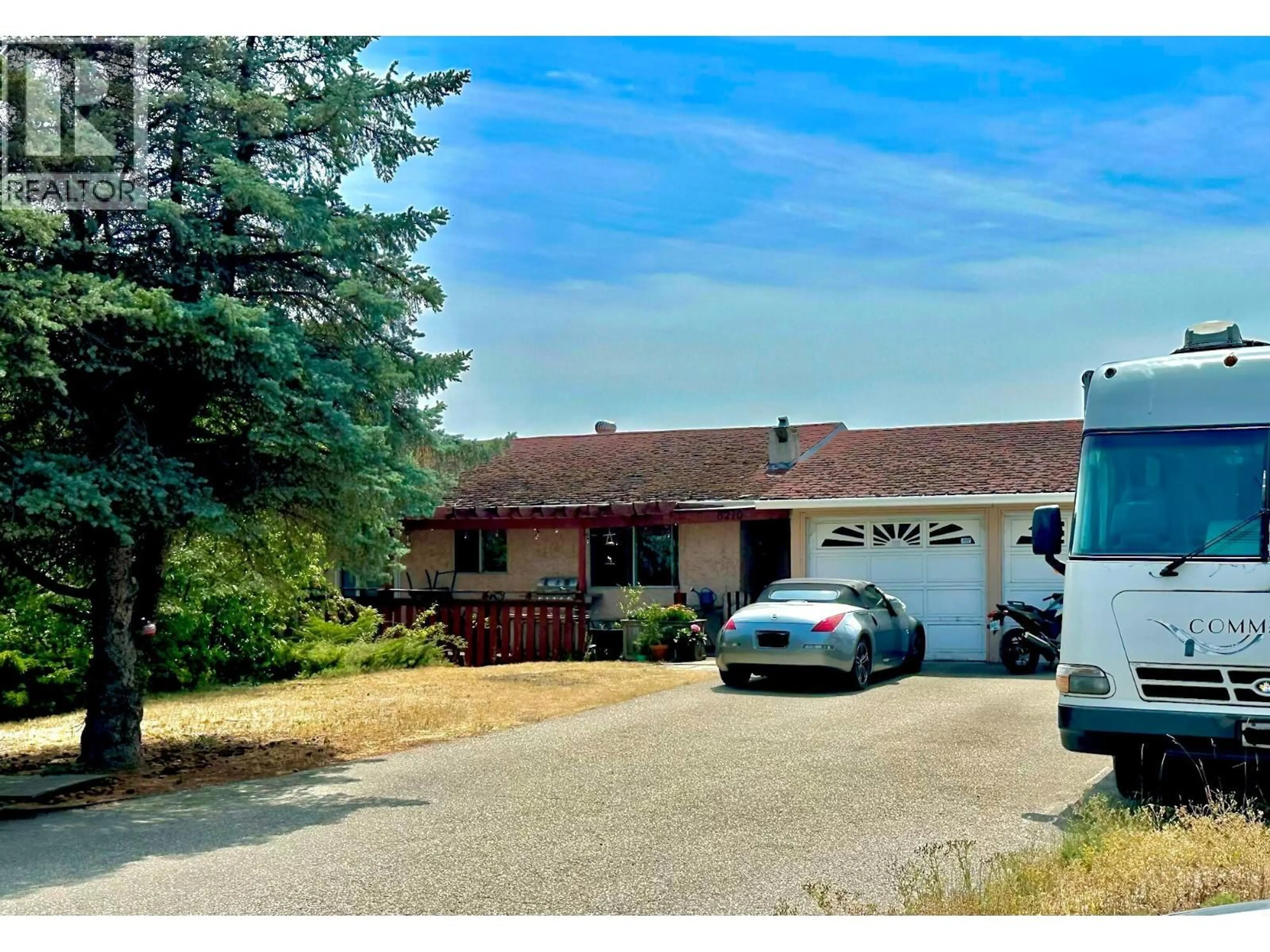 A pic from outside/outdoor area/front of a property/back of a property/a pic from drone, street for 8210 OKANAGAN CENTRE ROAD WEST, Lake Country British Columbia V4V1M8