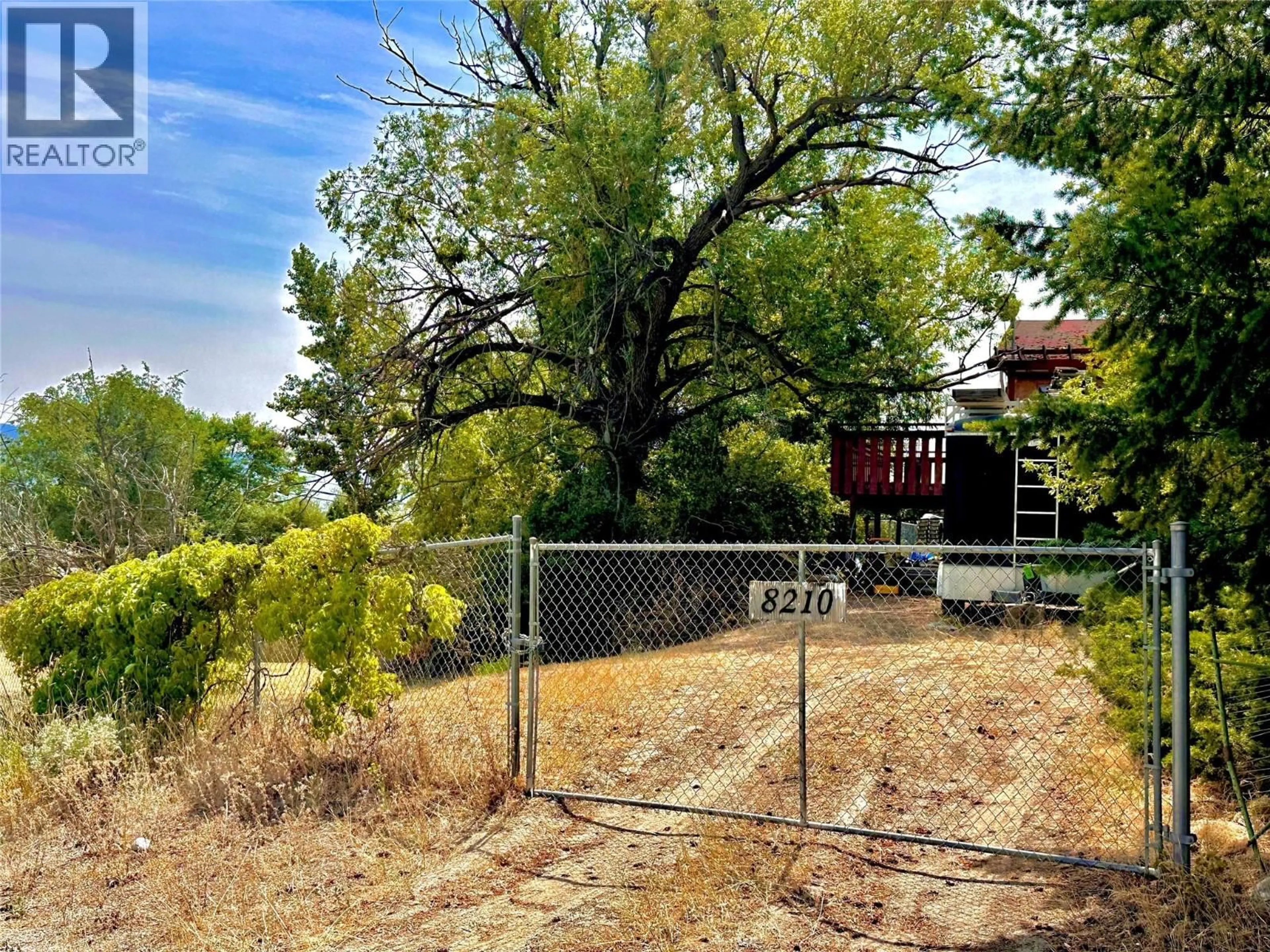 A pic from outside/outdoor area/front of a property/back of a property/a pic from drone, forest/trees view for 8210 OKANAGAN CENTRE ROAD WEST, Lake Country British Columbia V4V1M8