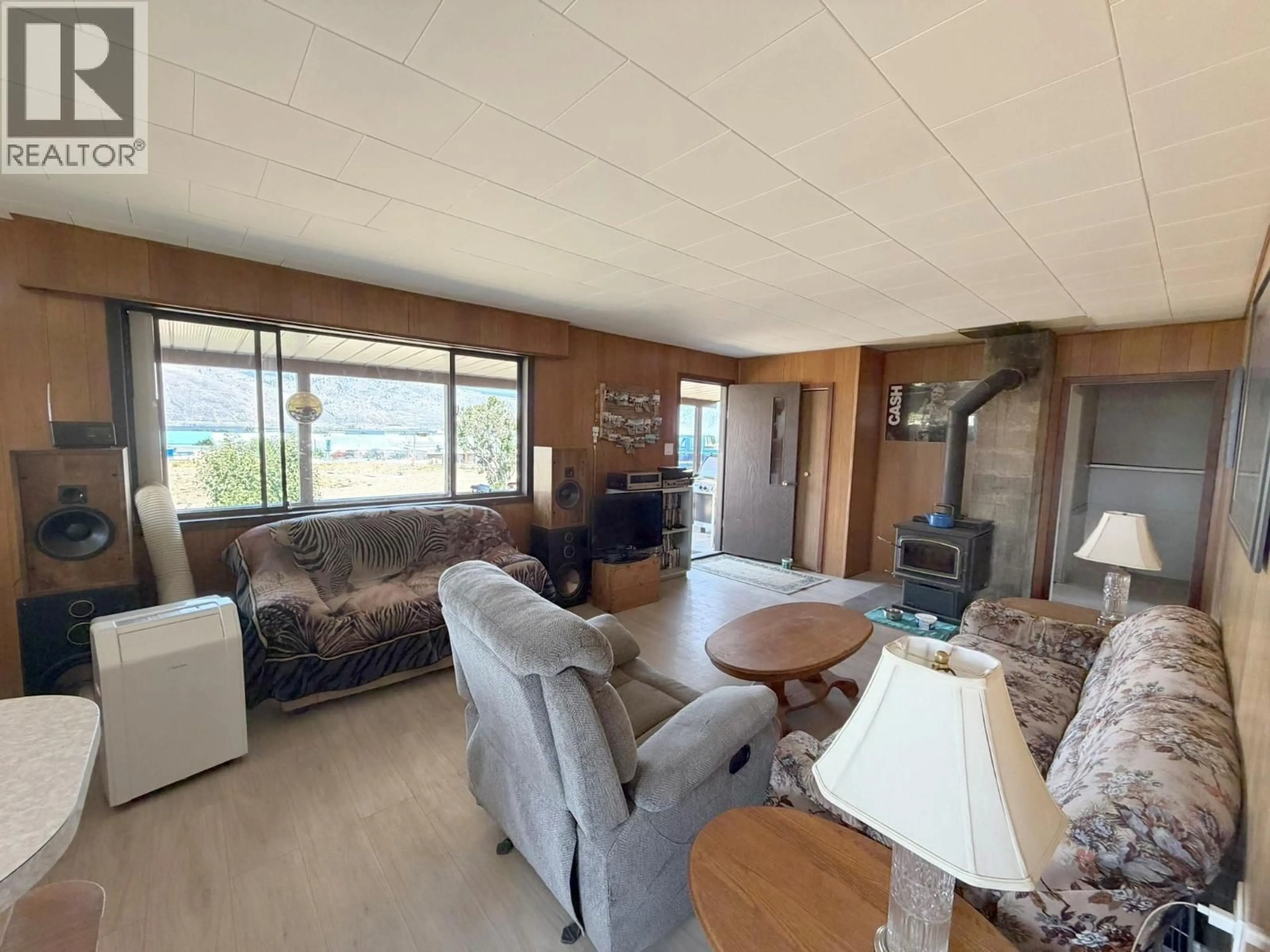 Living room with furniture, wood/laminate floor for 130 BALLOU ROAD, Kamloops British Columbia V0K2J0