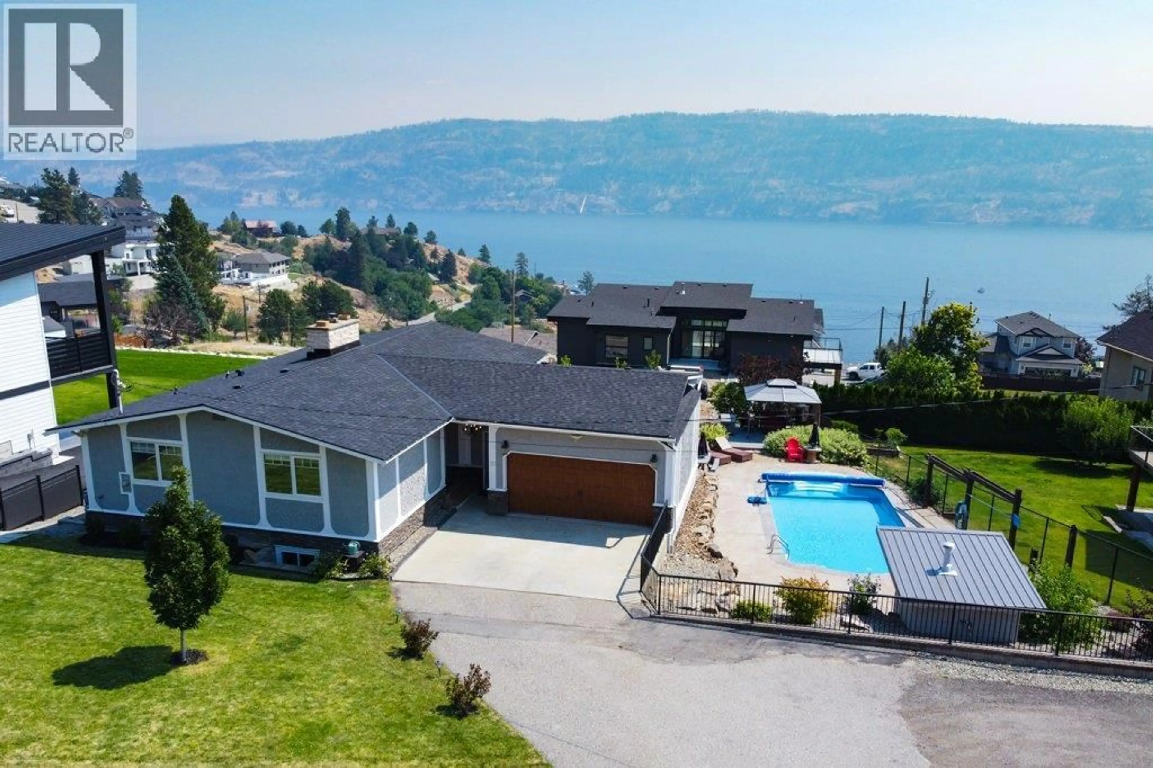 A pic from outside/outdoor area/front of a property/back of a property/a pic from drone, water/lake/river/ocean view for 111 WESTSIDE ROAD NORTH, Kelowna British Columbia V1Z3S4