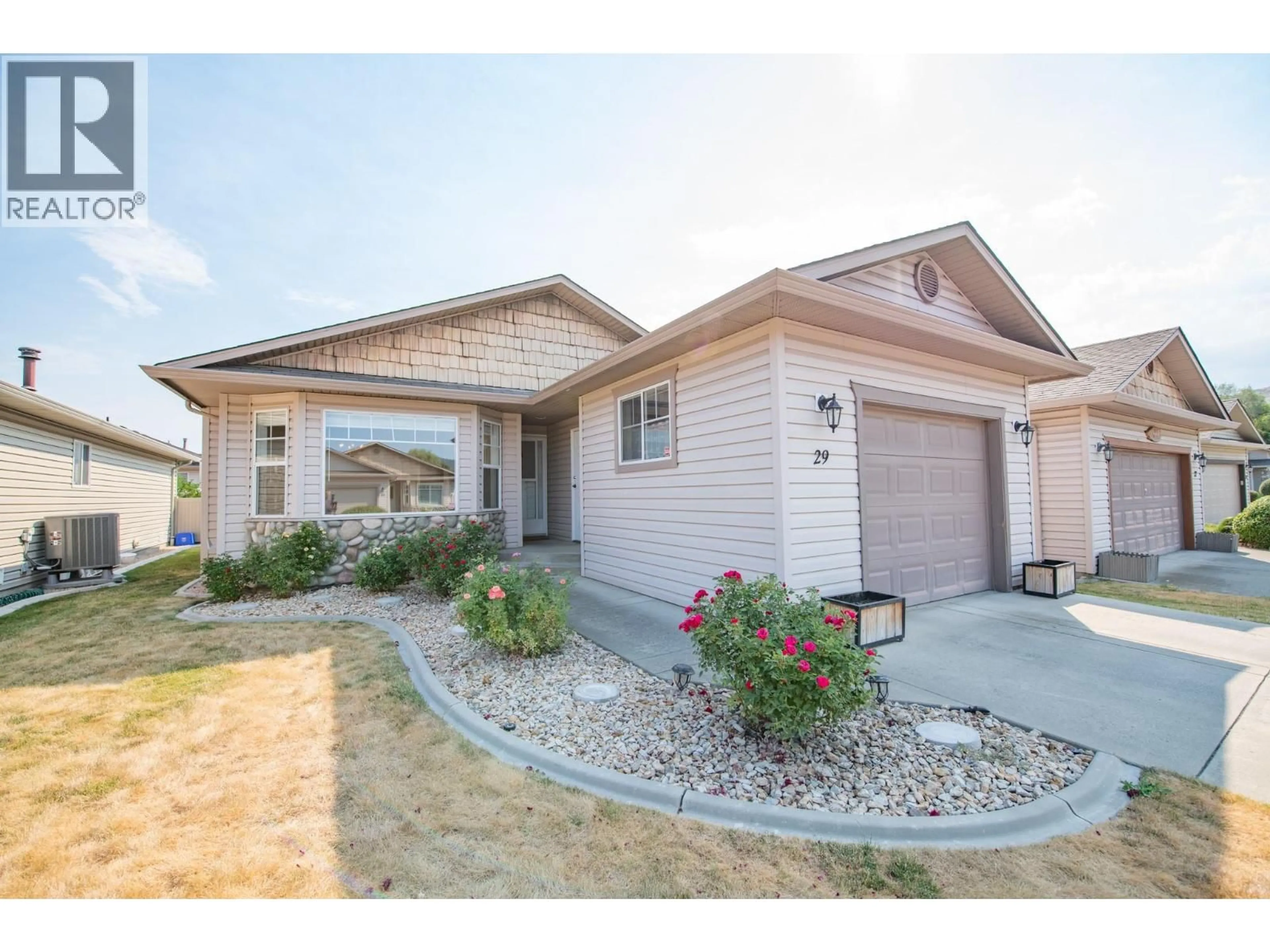 Home with vinyl exterior material, street for 29 - 5888 OKANAGAN LANDING ROAD, Vernon British Columbia V1H1S2