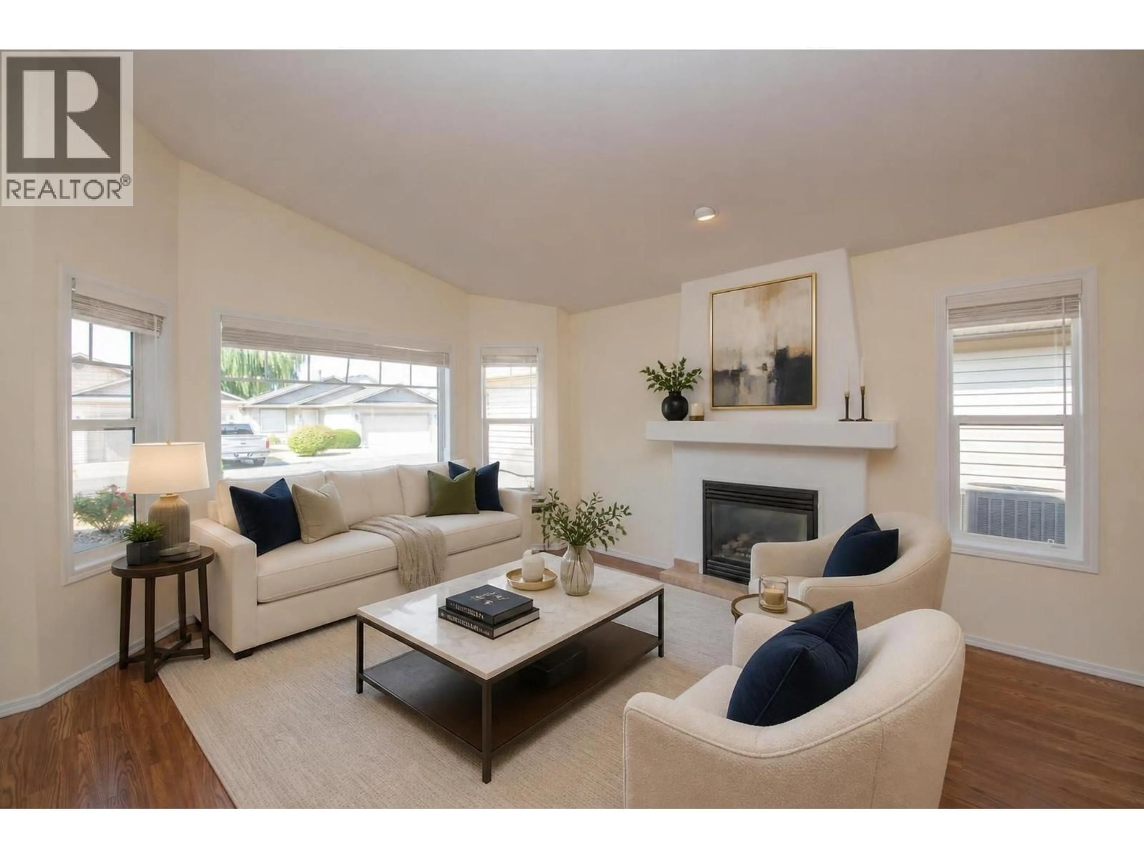 Living room with furniture, wood/laminate floor for 29 - 5888 OKANAGAN LANDING ROAD, Vernon British Columbia V1H1S2