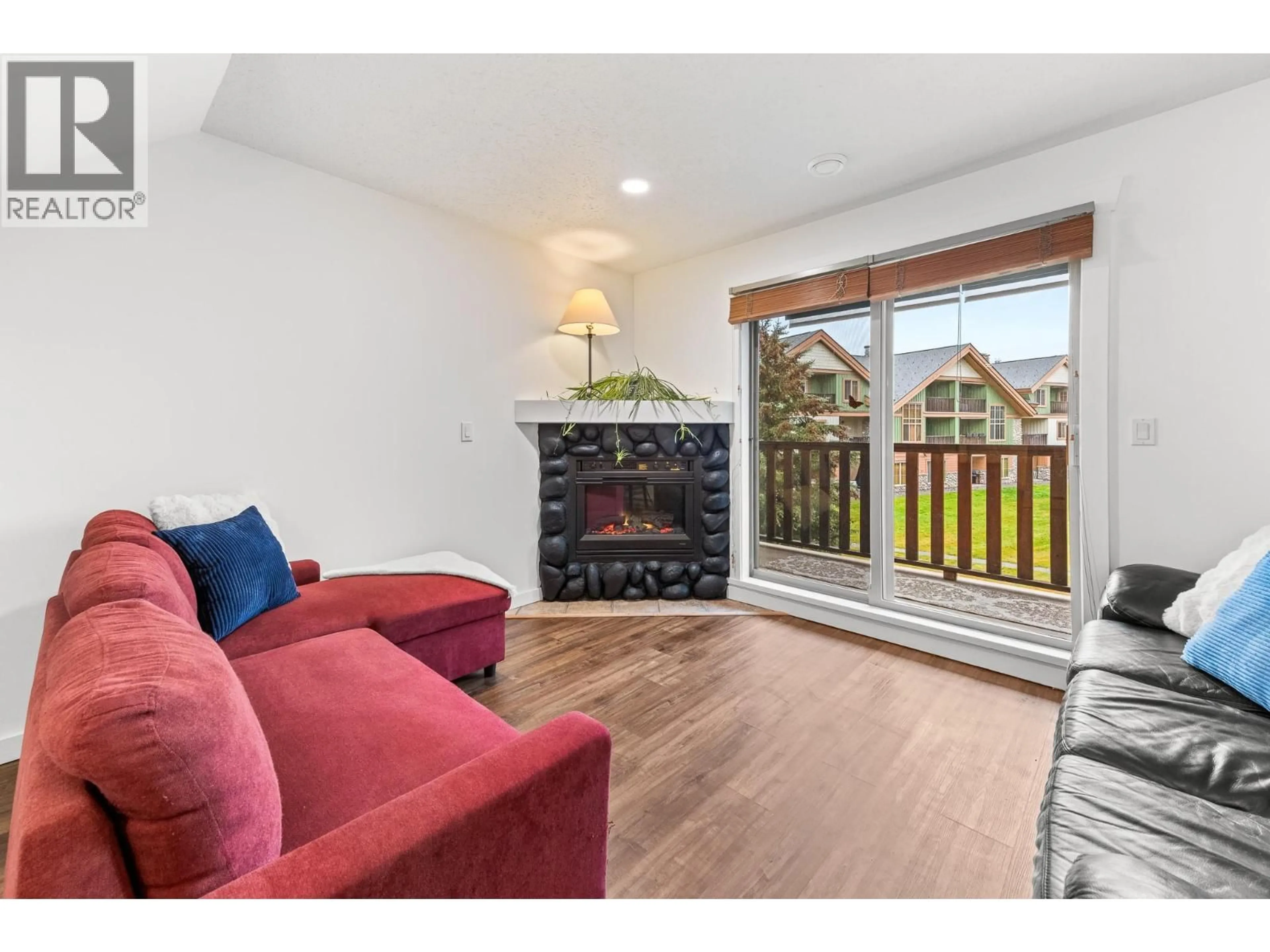 Living room with furniture, wood/laminate floor for 202A - 32 RIVERMOUNT PLACE, Fernie British Columbia V0B1M7