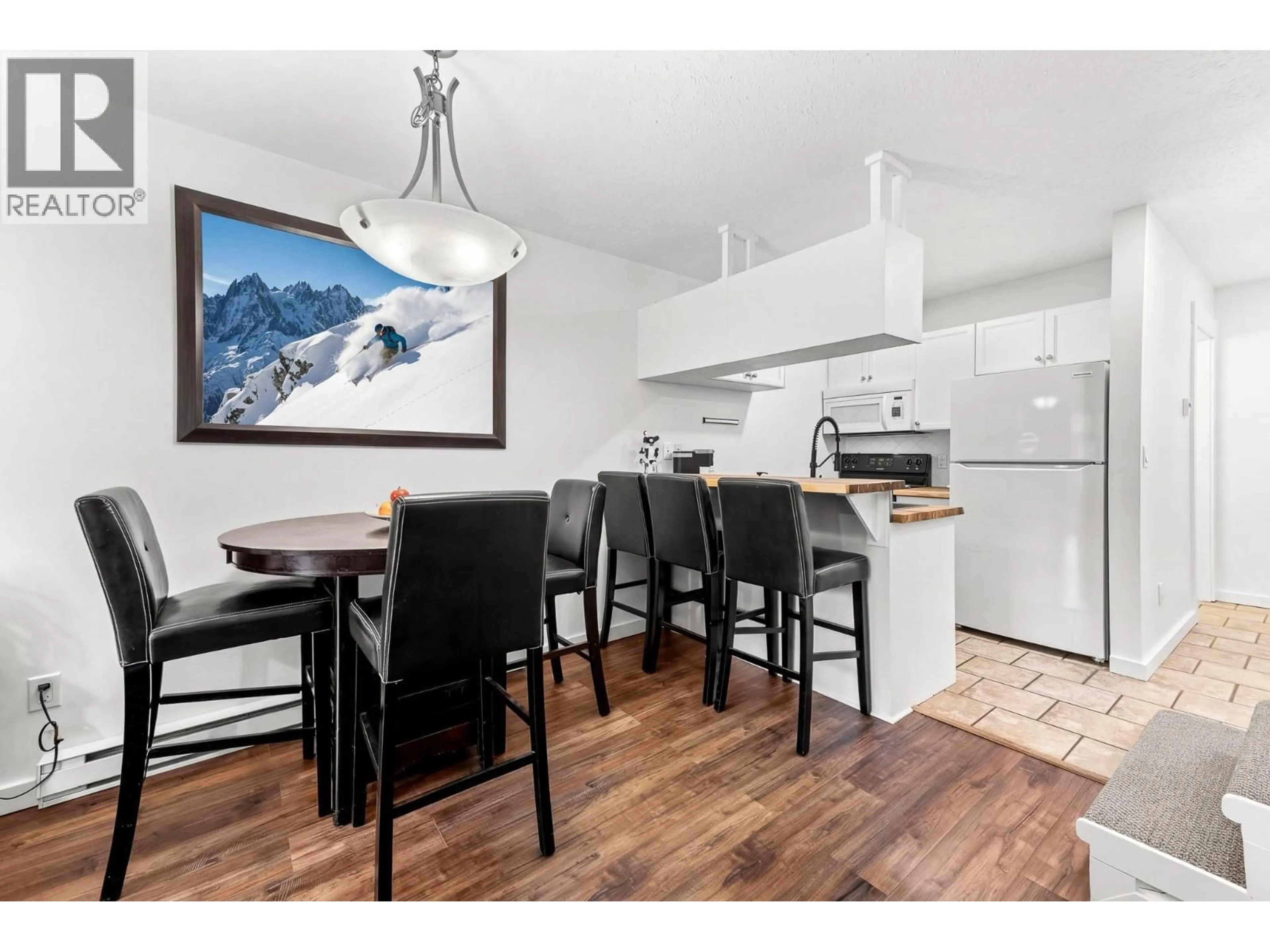Open concept kitchen, wood/laminate floor for 202A - 32 RIVERMOUNT PLACE, Fernie British Columbia V0B1M7