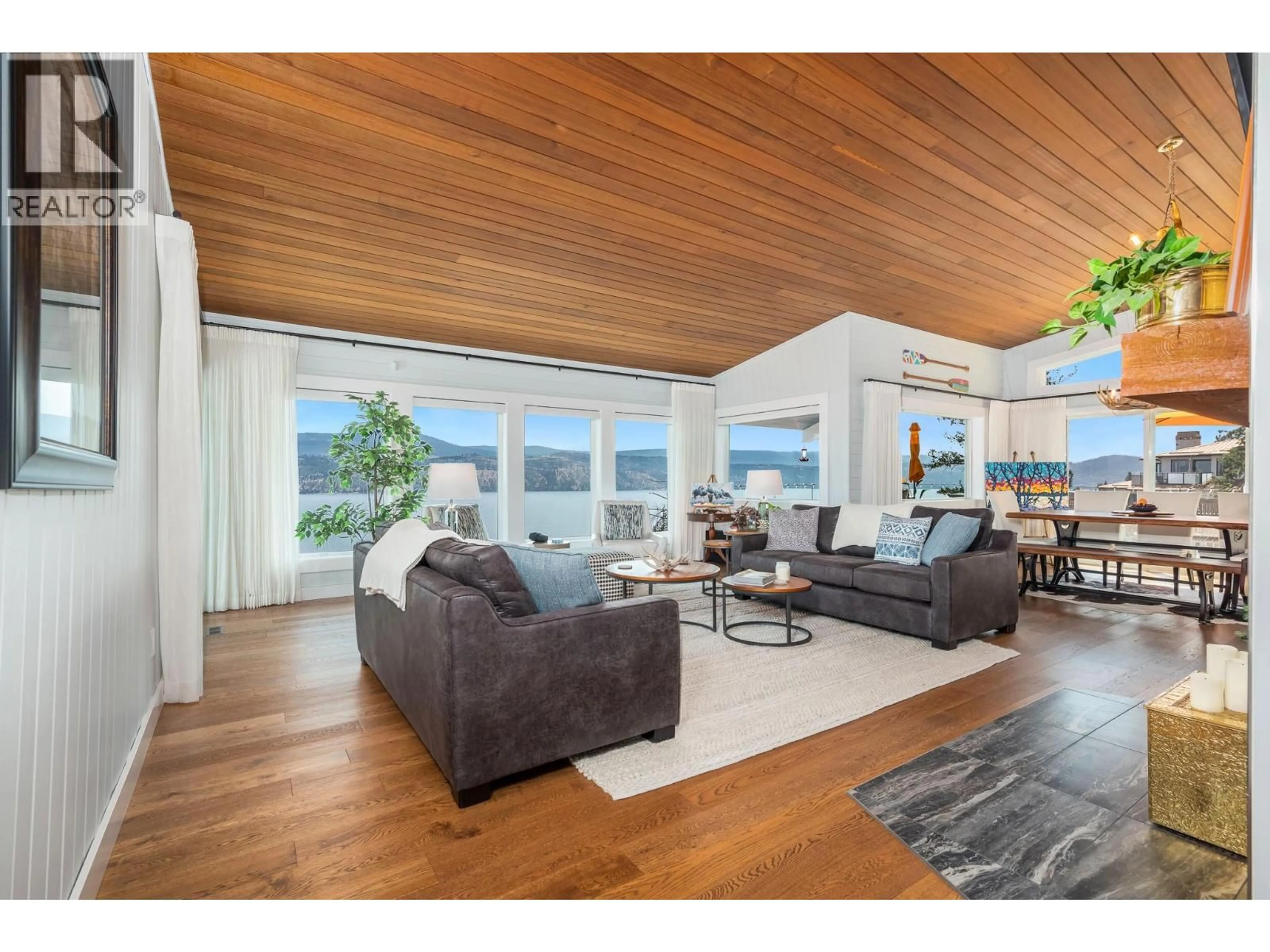 Living room with furniture, wood/laminate floor for 3723 WESTSIDE ROAD NORTH, Kelowna British Columbia V1Z3W8