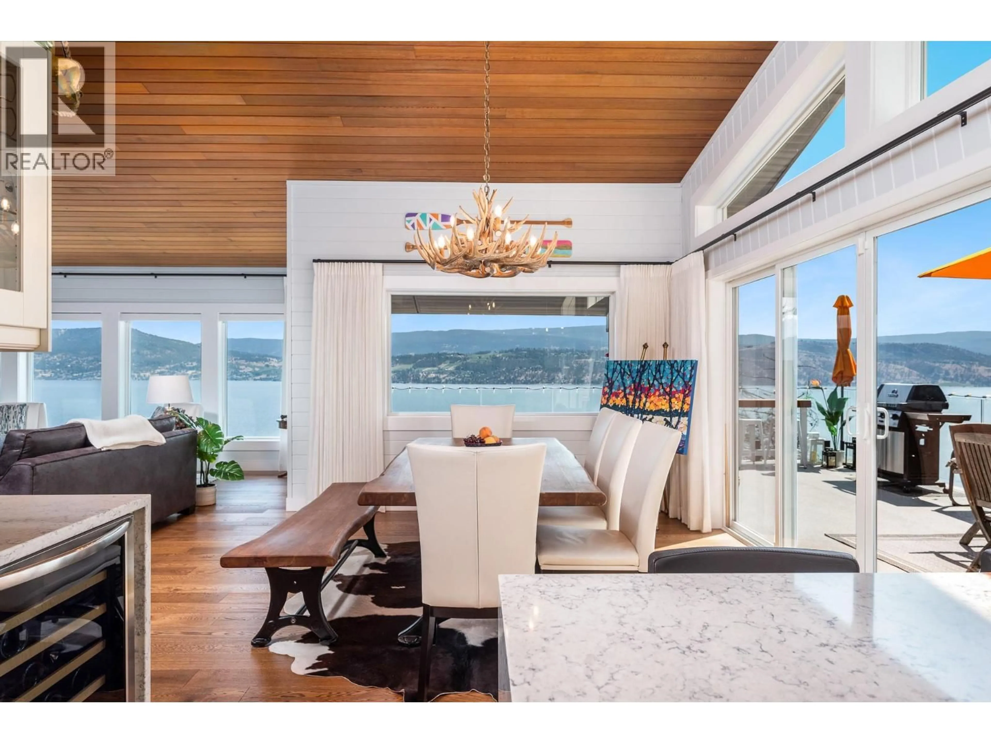 Dining room, wood/laminate floor for 3723 WESTSIDE ROAD NORTH, Kelowna British Columbia V1Z3W8