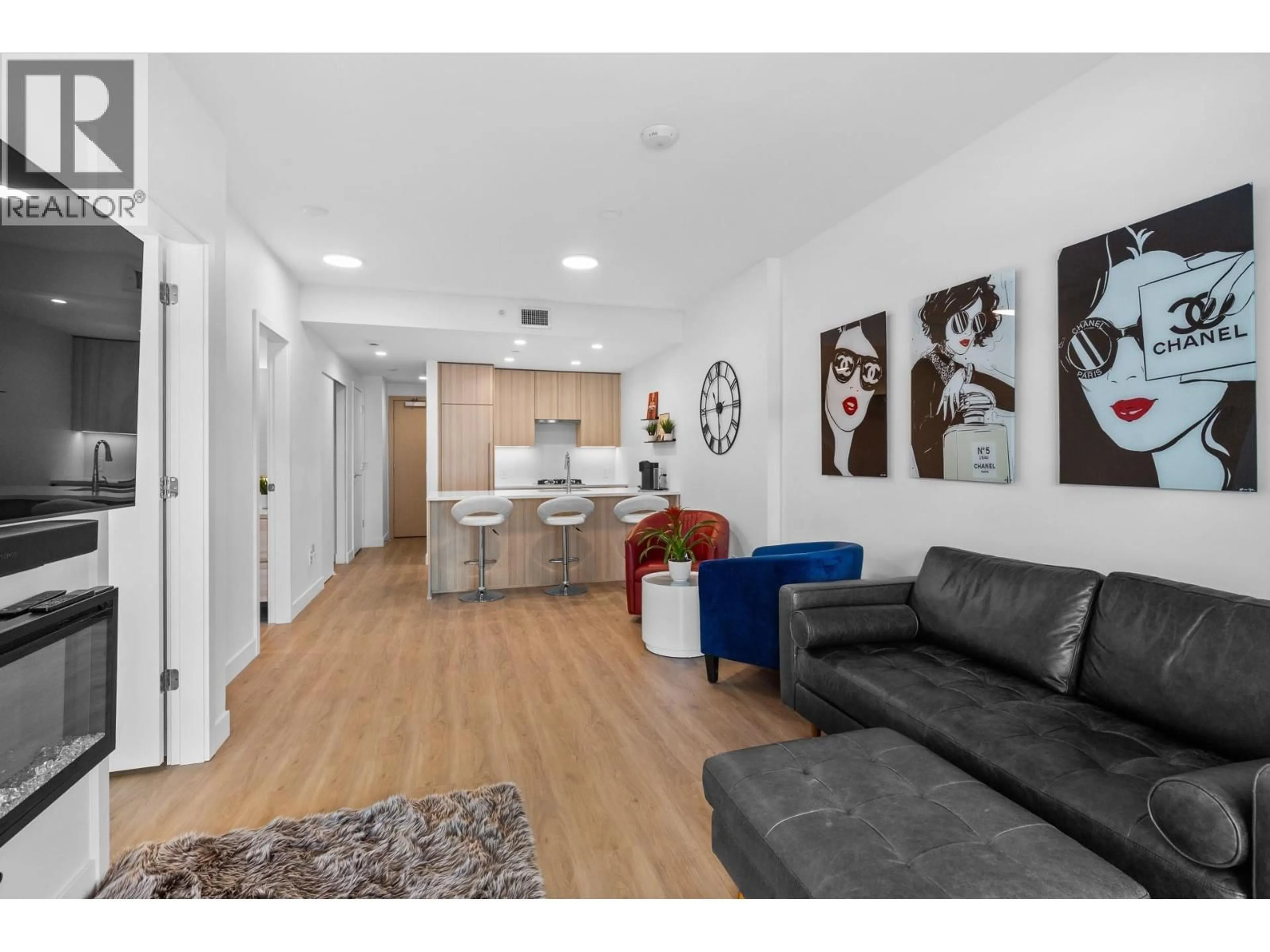 Living room with furniture, wood/laminate floor for 1808 - 1626 WATER STREET, Kelowna British Columbia V1Y0N7