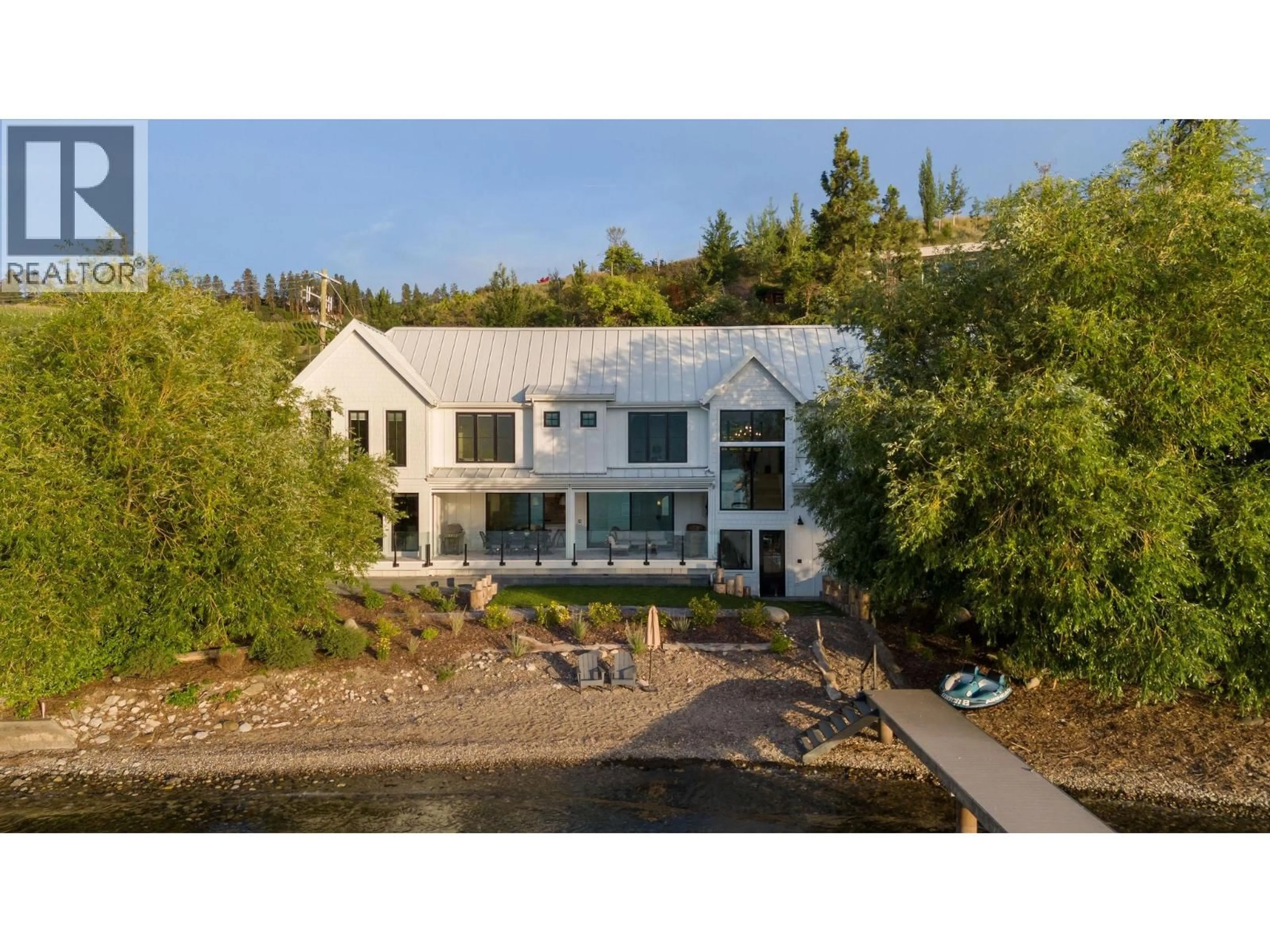 A pic from outside/outdoor area/front of a property/back of a property/a pic from drone, water/lake/river/ocean view for 5268 LAKESHORE ROAD, Kelowna British Columbia V1W4J3