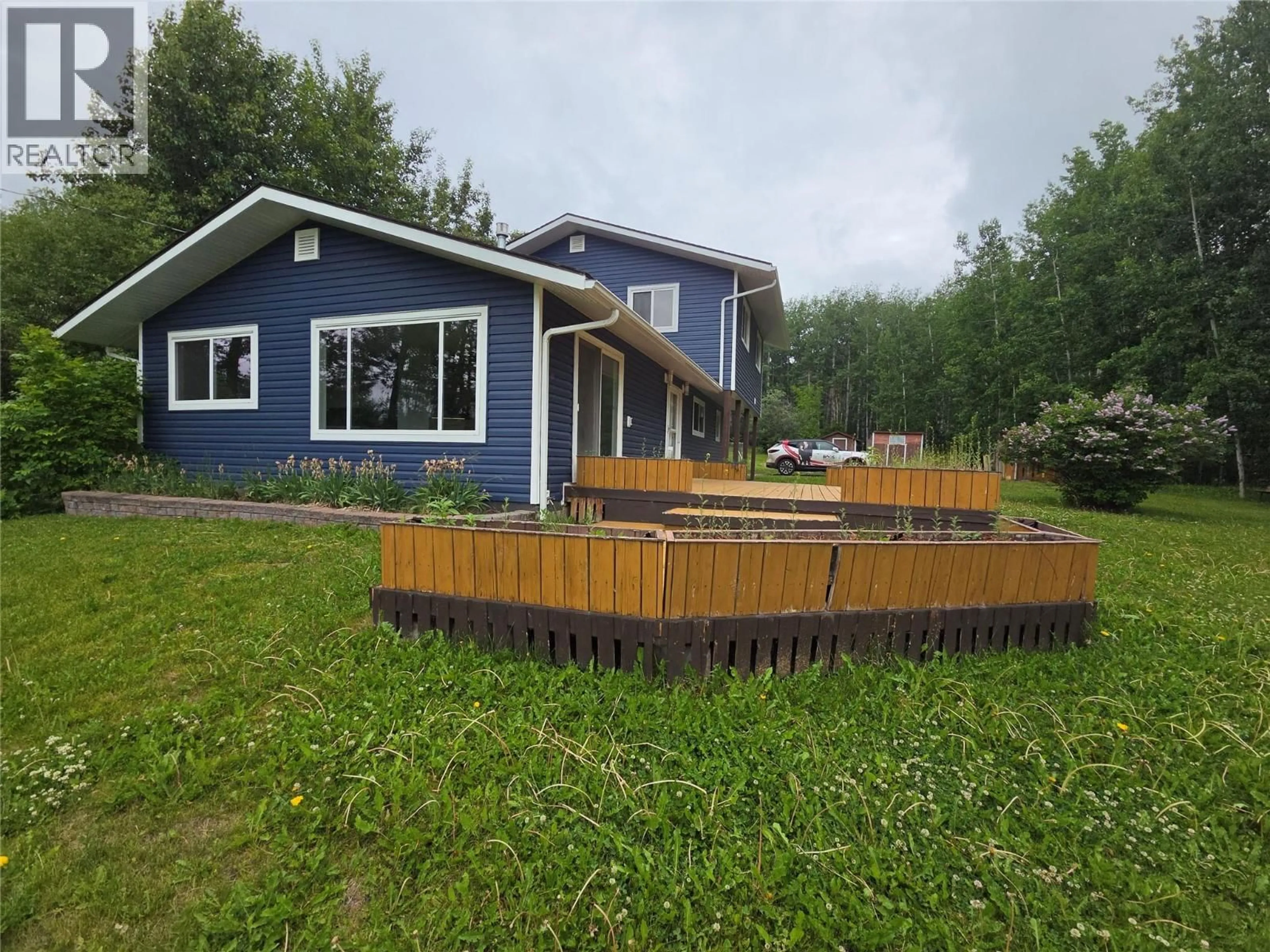 A pic from outside/outdoor area/front of a property/back of a property/a pic from drone, water/lake/river/ocean view for 6640 LAKESHORE DRIVE, Moberly Lake British Columbia V0C1X0