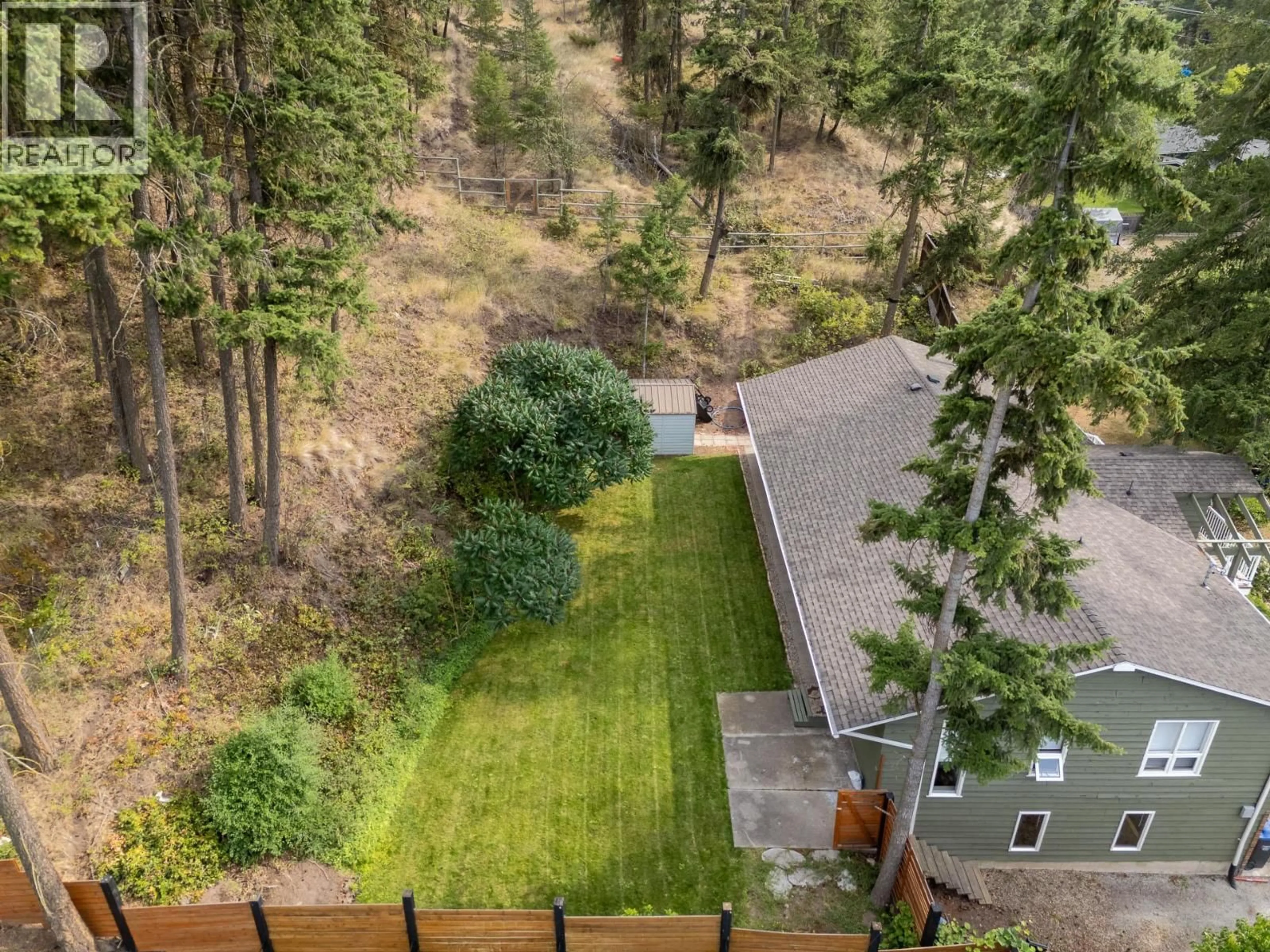 A pic from outside/outdoor area/front of a property/back of a property/a pic from drone, forest/trees view for 353 CLIFTON ROAD SOUTH, Kelowna British Columbia V1V1A4