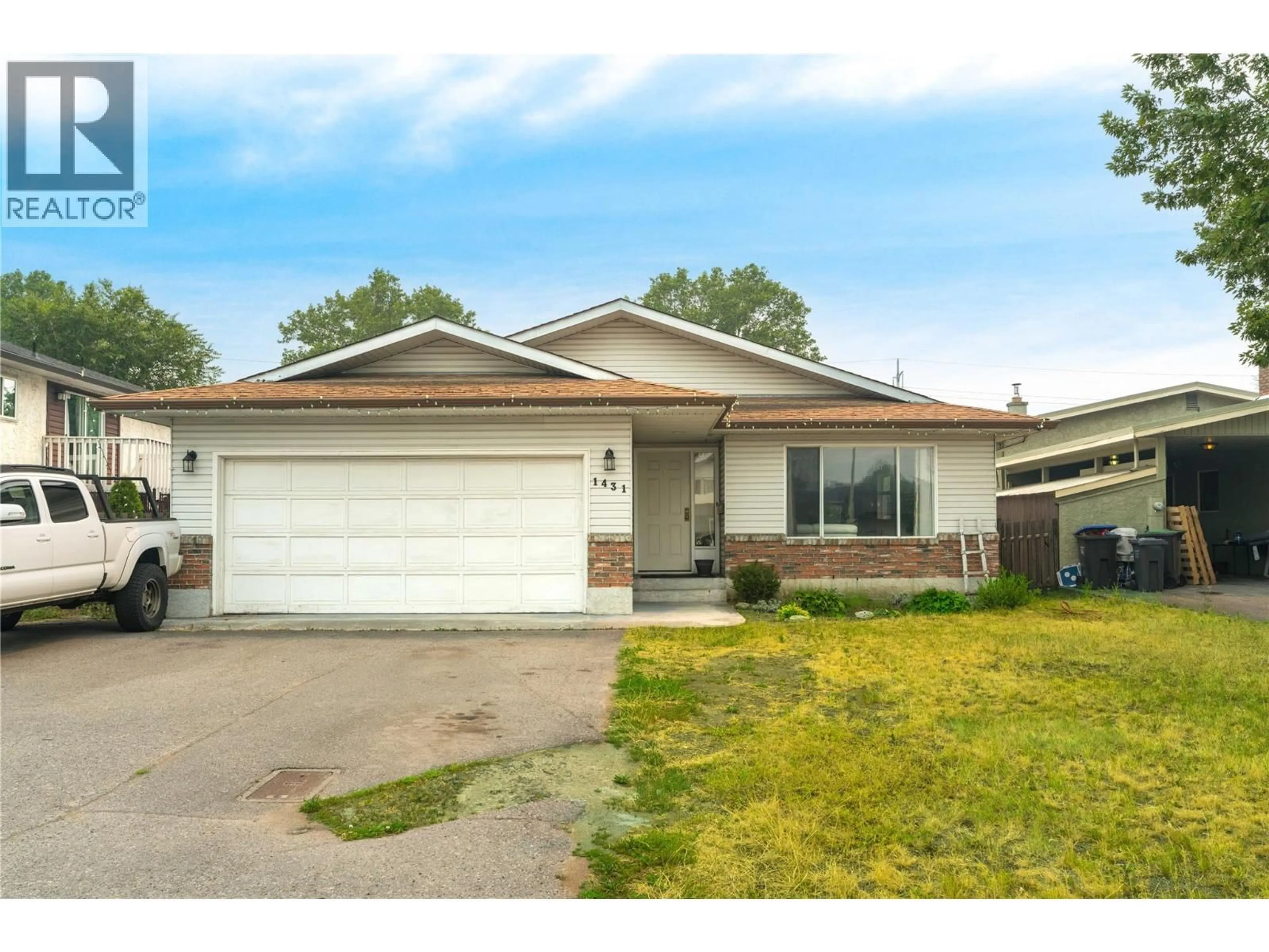 Home with vinyl exterior material, street for 1431 INKAR ROAD, Kelowna British Columbia V1Y8J1