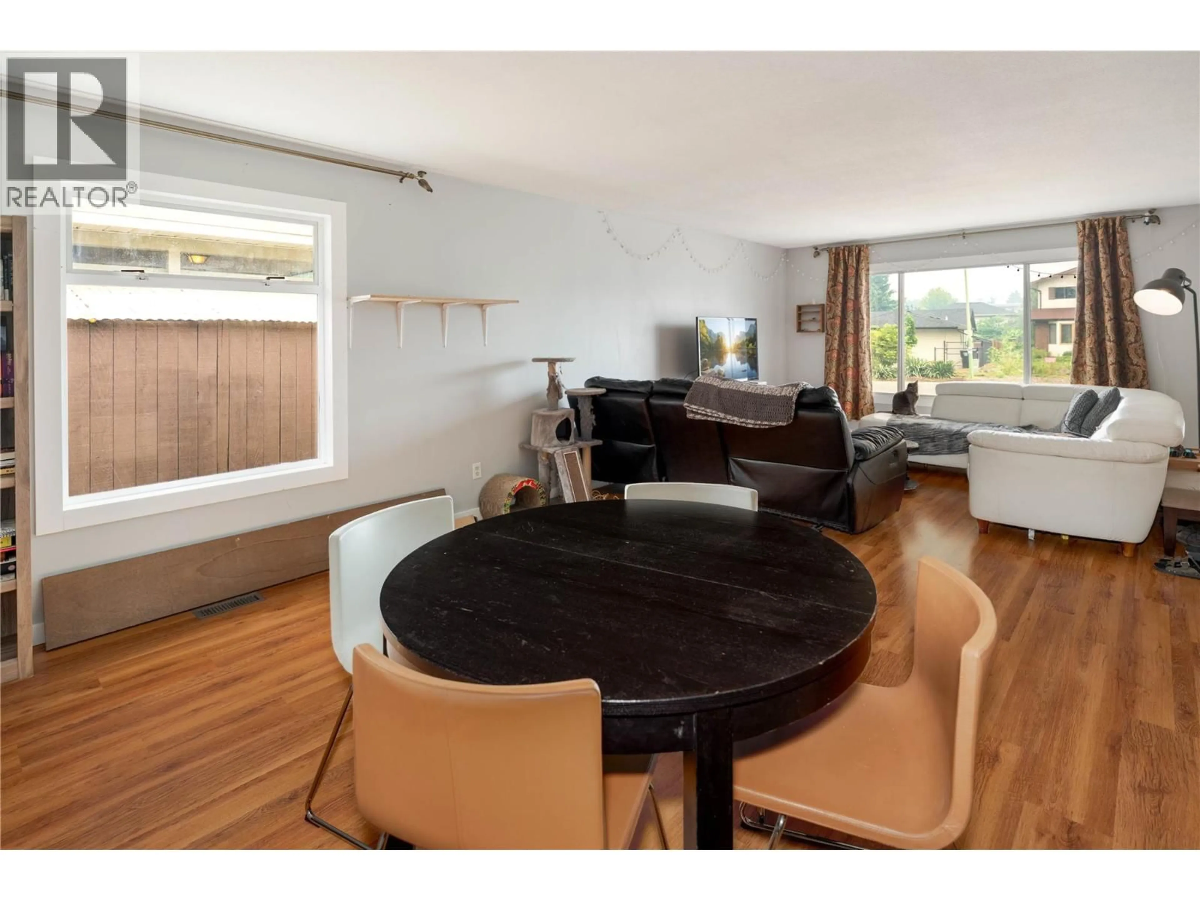 Dining room, wood/laminate floor for 1431 INKAR ROAD, Kelowna British Columbia V1Y8J1