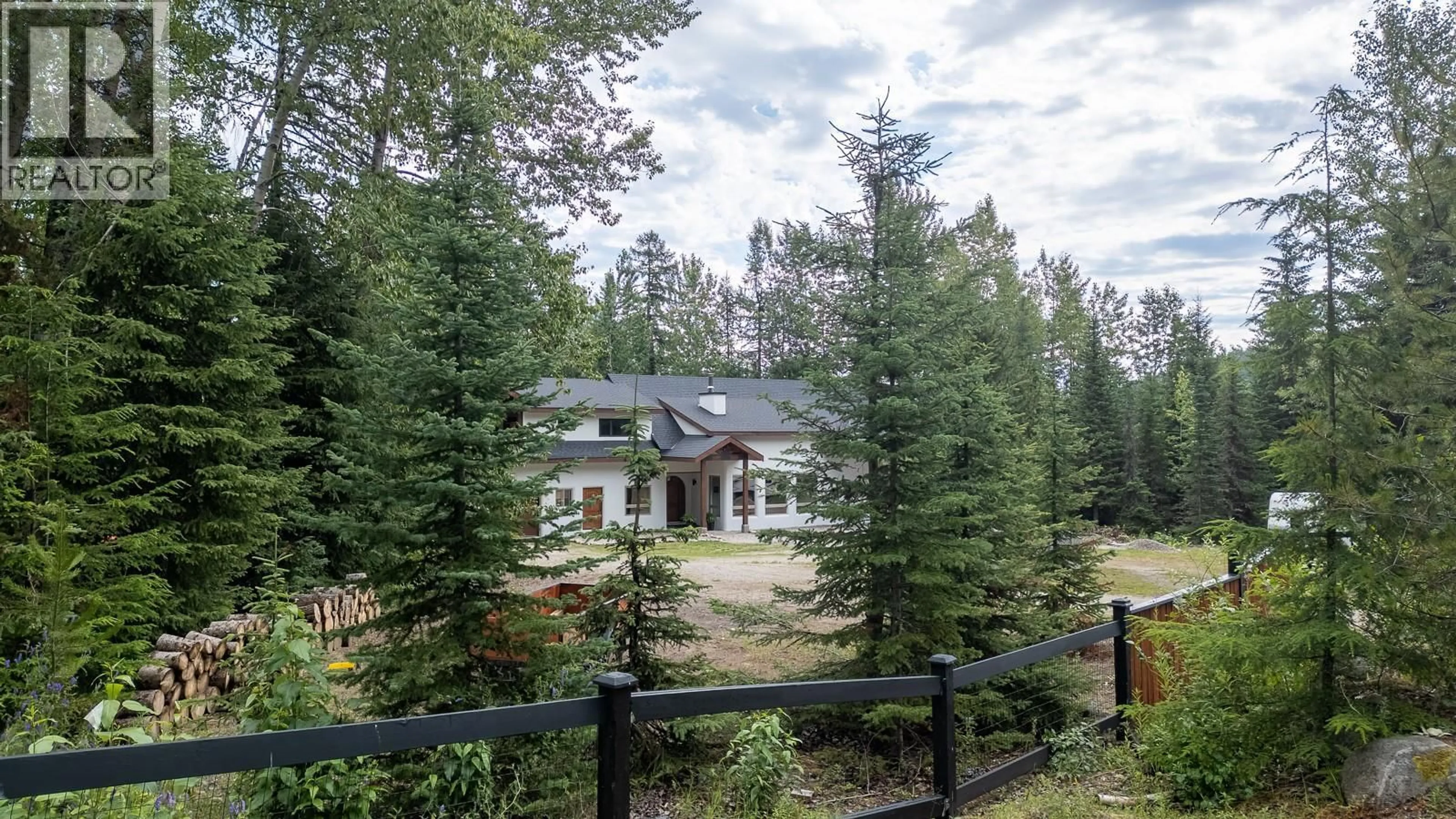 A pic from outside/outdoor area/front of a property/back of a property/a pic from drone, forest/trees view for 120 RICHIE ROAD, Rossland British Columbia V0G1Y0