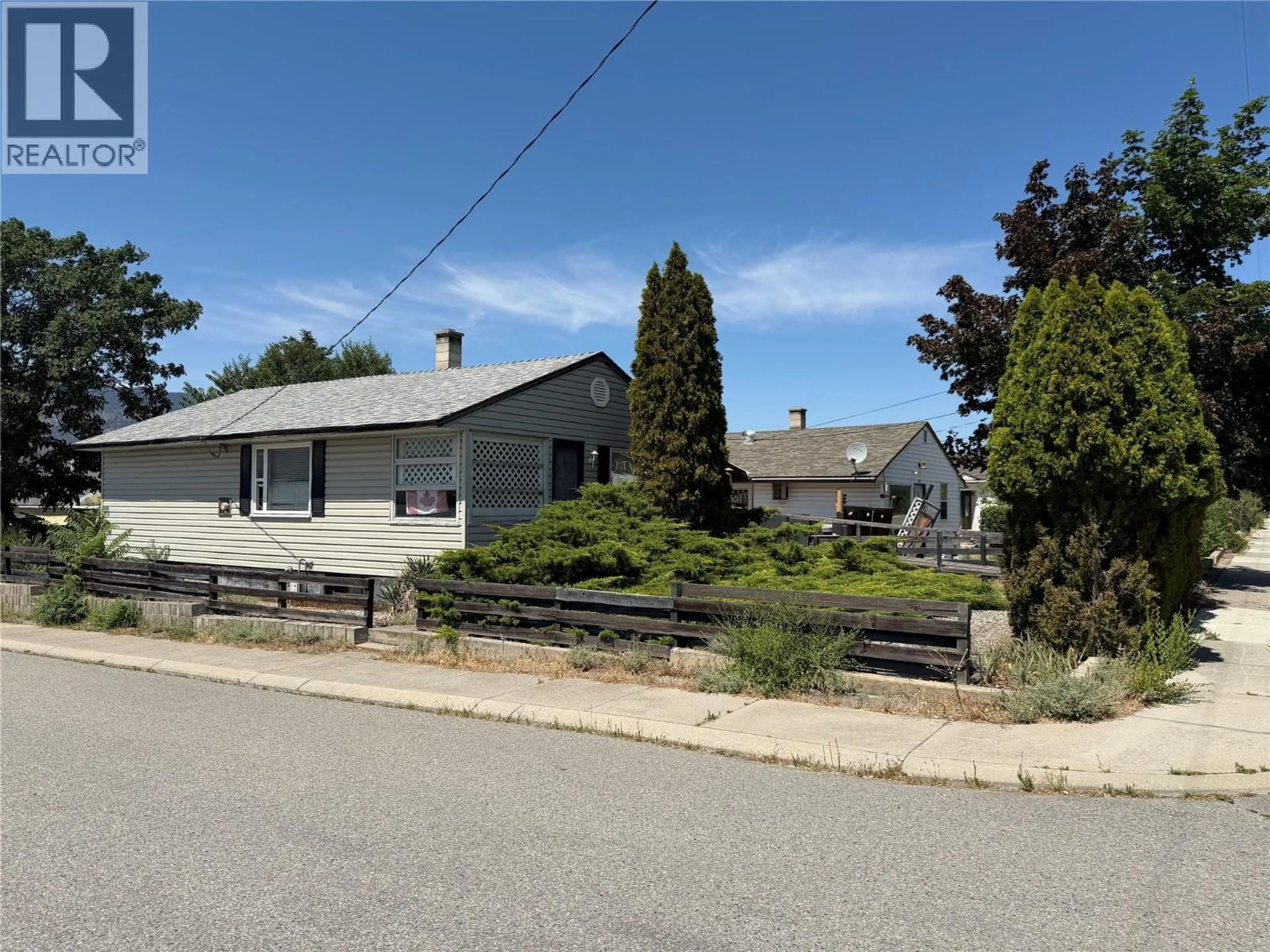 A pic from outside/outdoor area/front of a property/back of a property/a pic from drone, street for 1297 KING STREET, Penticton British Columbia V2A4S9