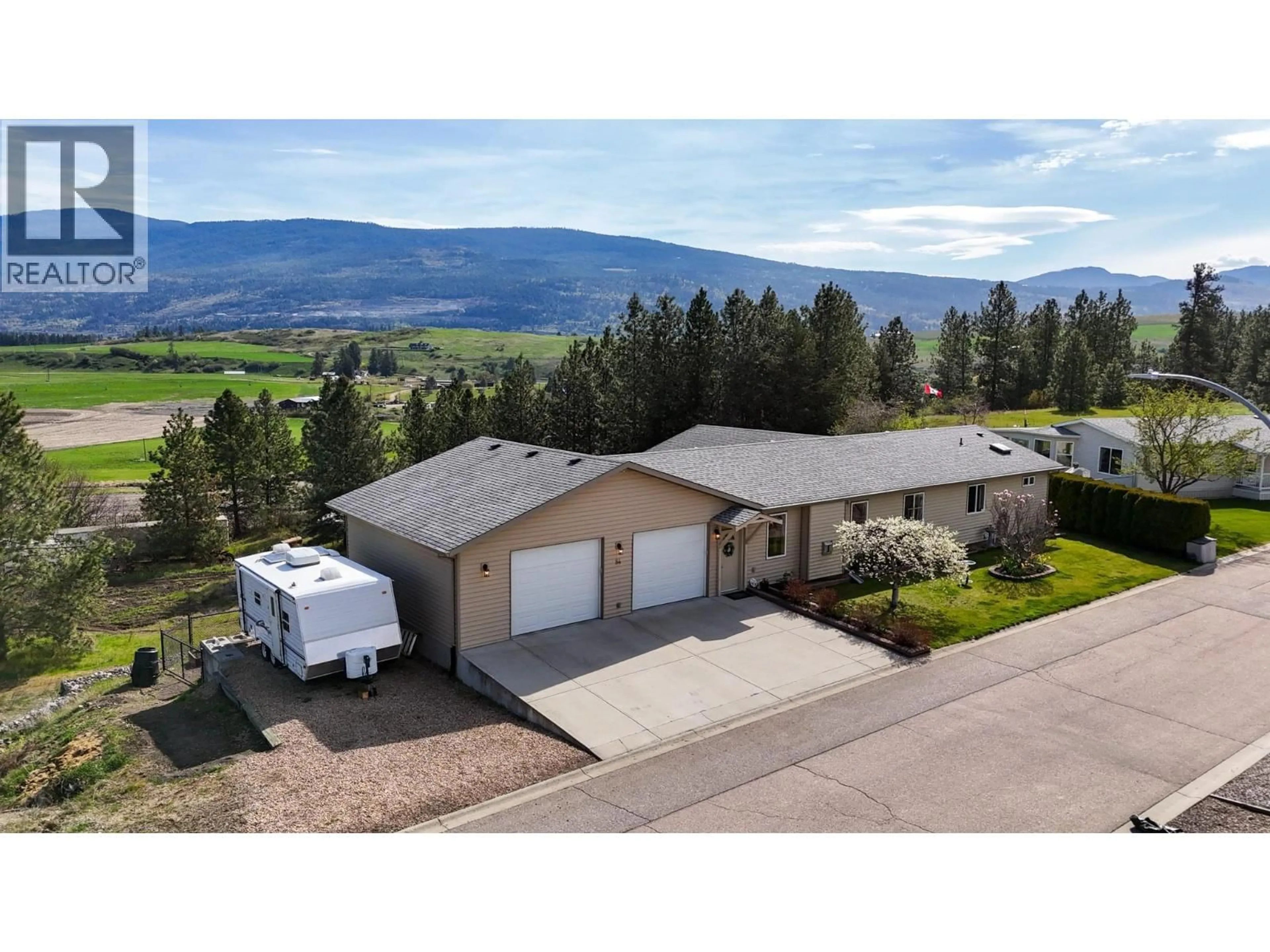 A pic from outside/outdoor area/front of a property/back of a property/a pic from drone, mountain view for 84 - 9510 97 HIGHWAY NORTH, Vernon British Columbia V1H1R8