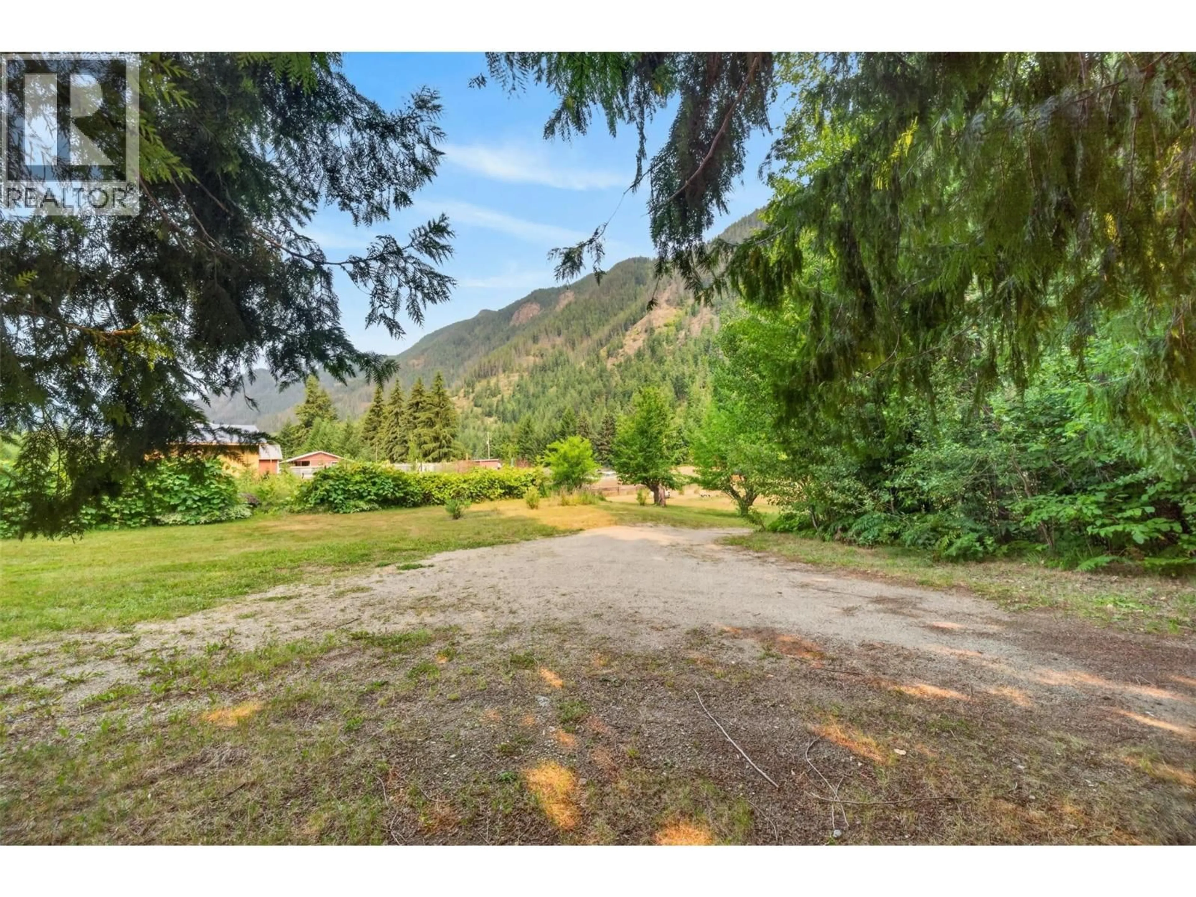 A pic from outside/outdoor area/front of a property/back of a property/a pic from drone, mountain view for 671 OLD TOWN ROAD, Sicamous British Columbia V0E2V4