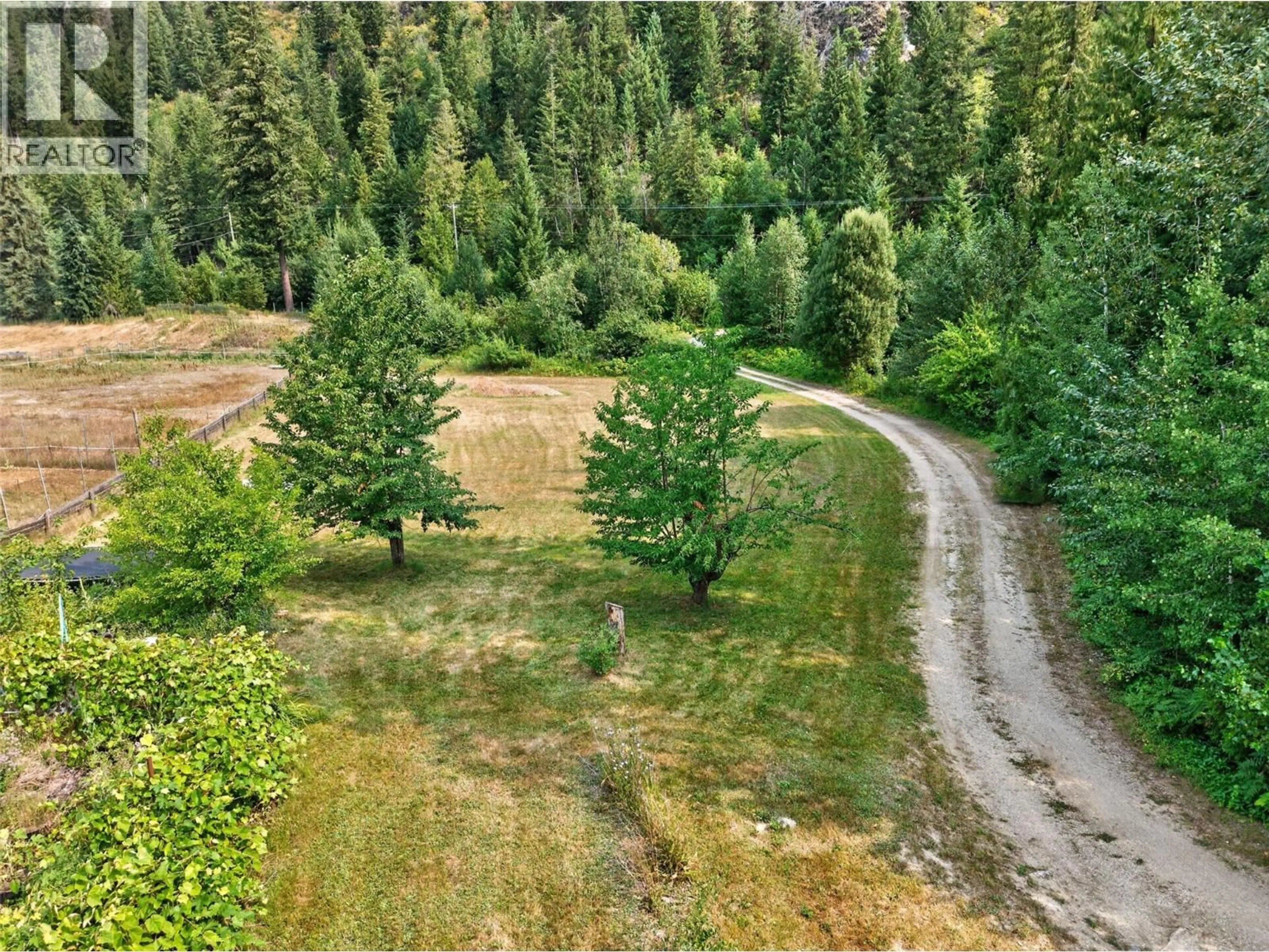A pic from outside/outdoor area/front of a property/back of a property/a pic from drone, forest/trees view for 671 OLD TOWN ROAD, Sicamous British Columbia V0E2V4