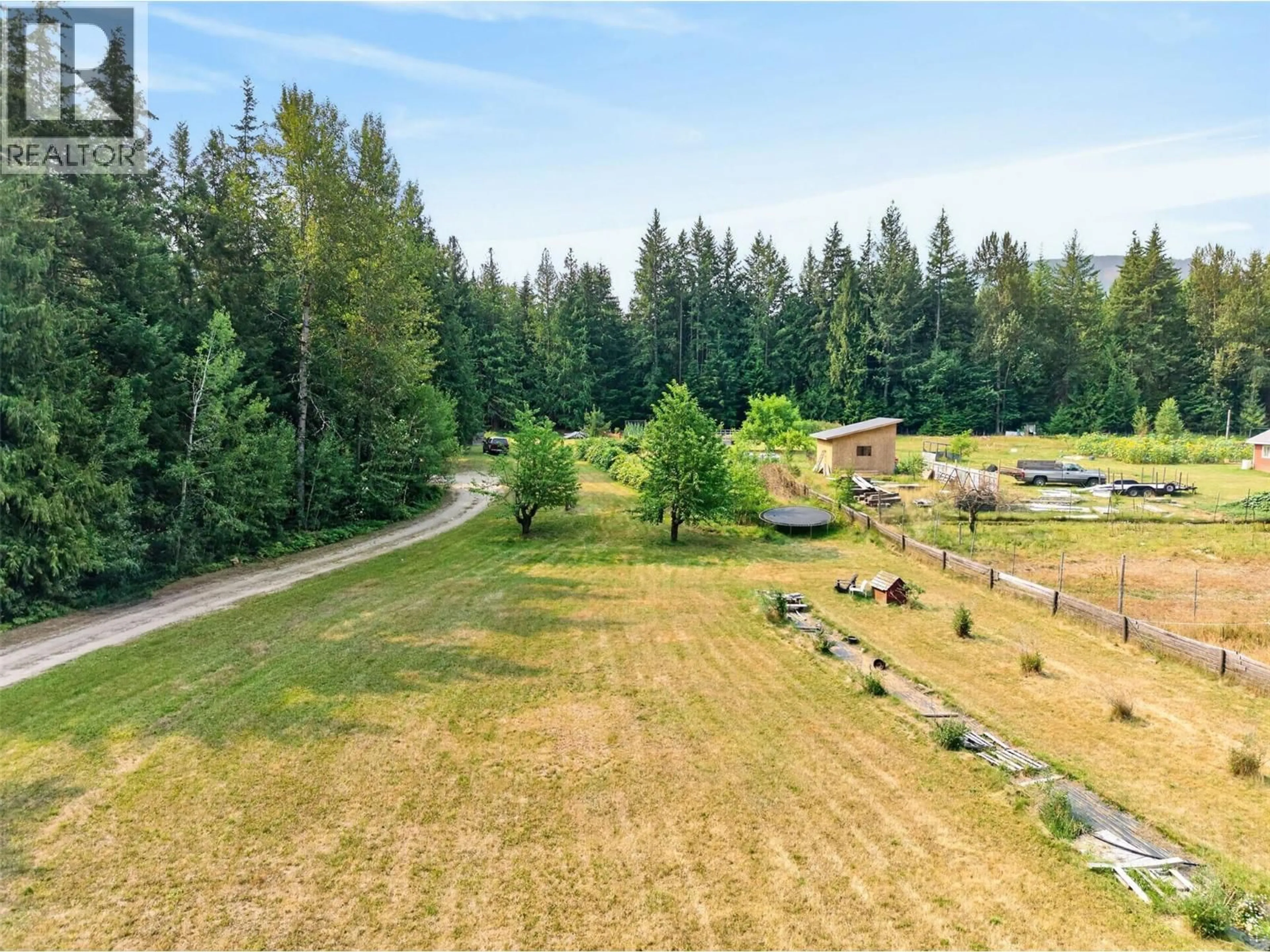 A pic from outside/outdoor area/front of a property/back of a property/a pic from drone, forest/trees view for 671 OLD TOWN ROAD, Sicamous British Columbia V0E2V4