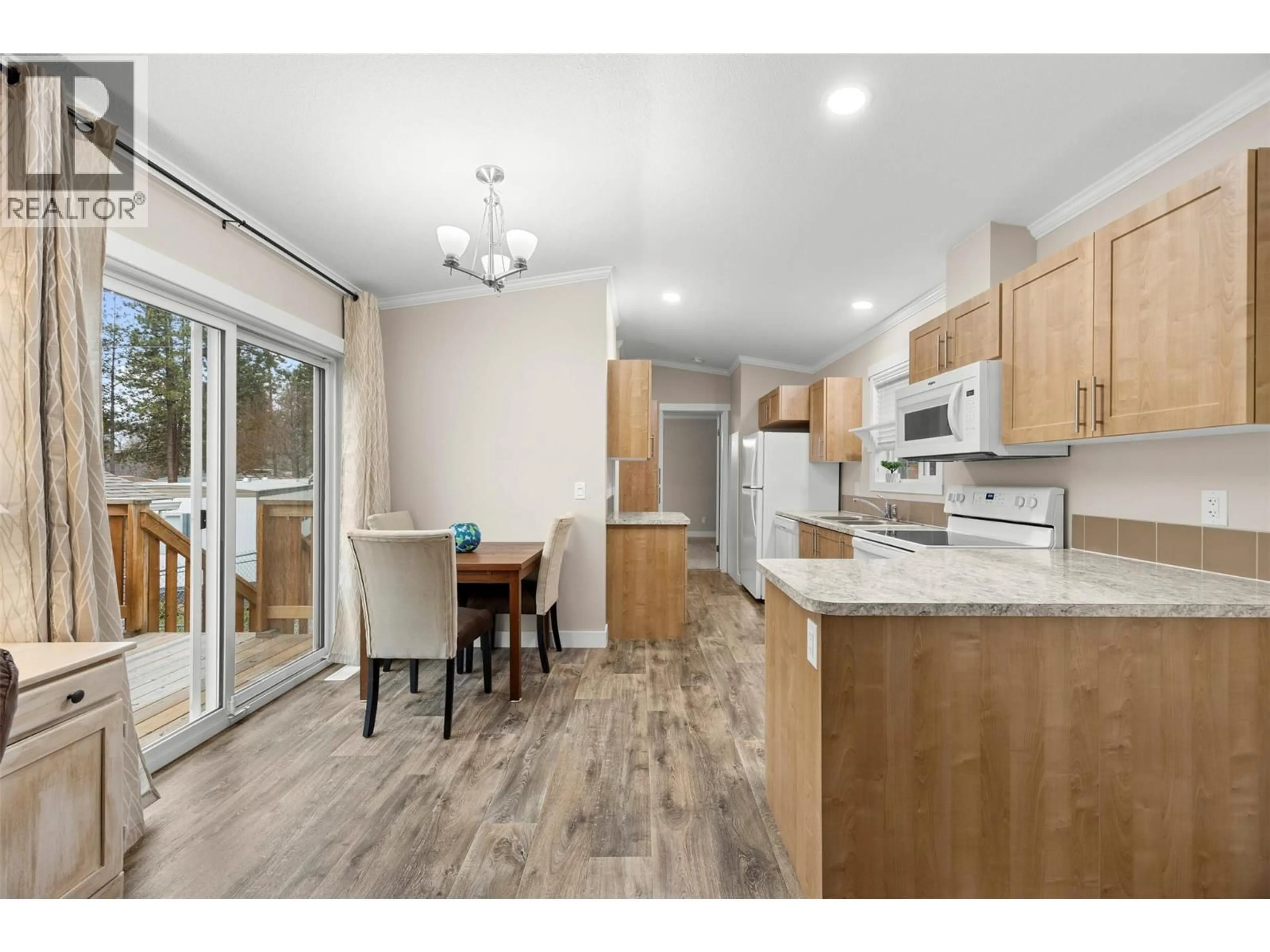 Open concept kitchen, wood/laminate floor for 33 - 1860 BOUCHERIE ROAD, West Kelowna British Columbia V4T2A2