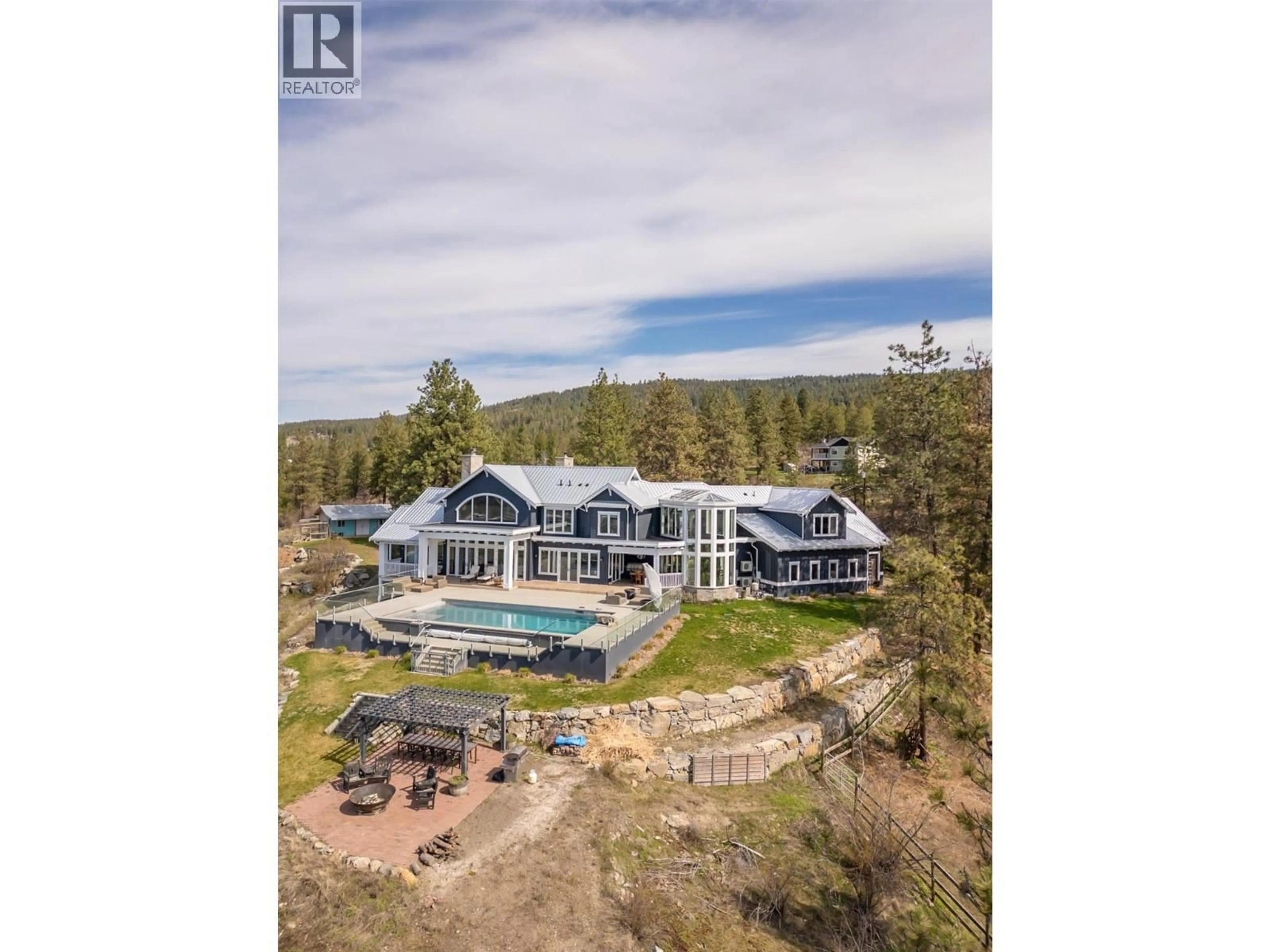 A pic from outside/outdoor area/front of a property/back of a property/a pic from drone, water/lake/river/ocean view for 5474 DEADPINE DRIVE, Kelowna British Columbia V1P1A3
