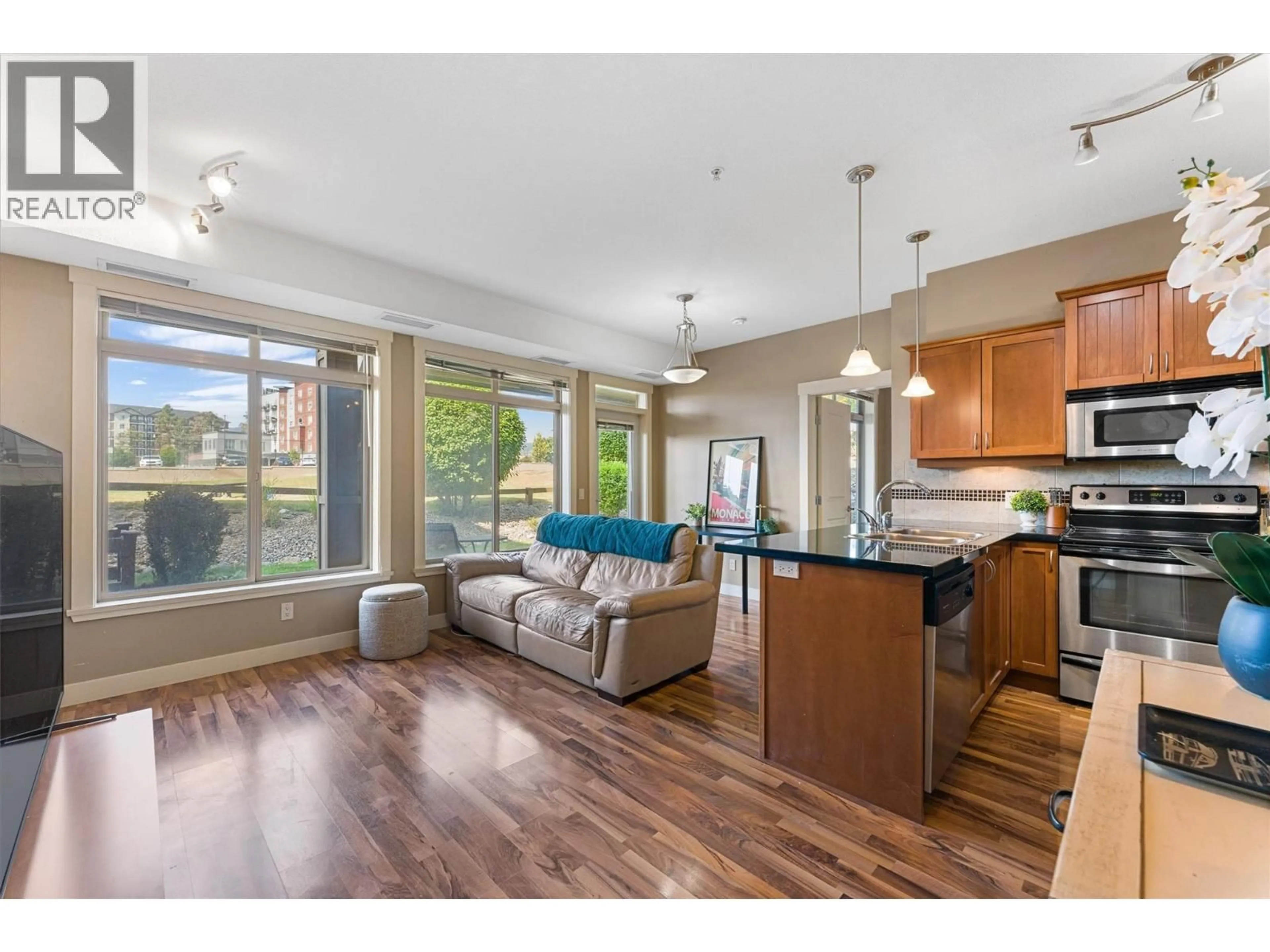 Open concept kitchen, wood/laminate floor for 112 - 3533 CARRINGTON ROAD, West Kelowna British Columbia V4T2Z9