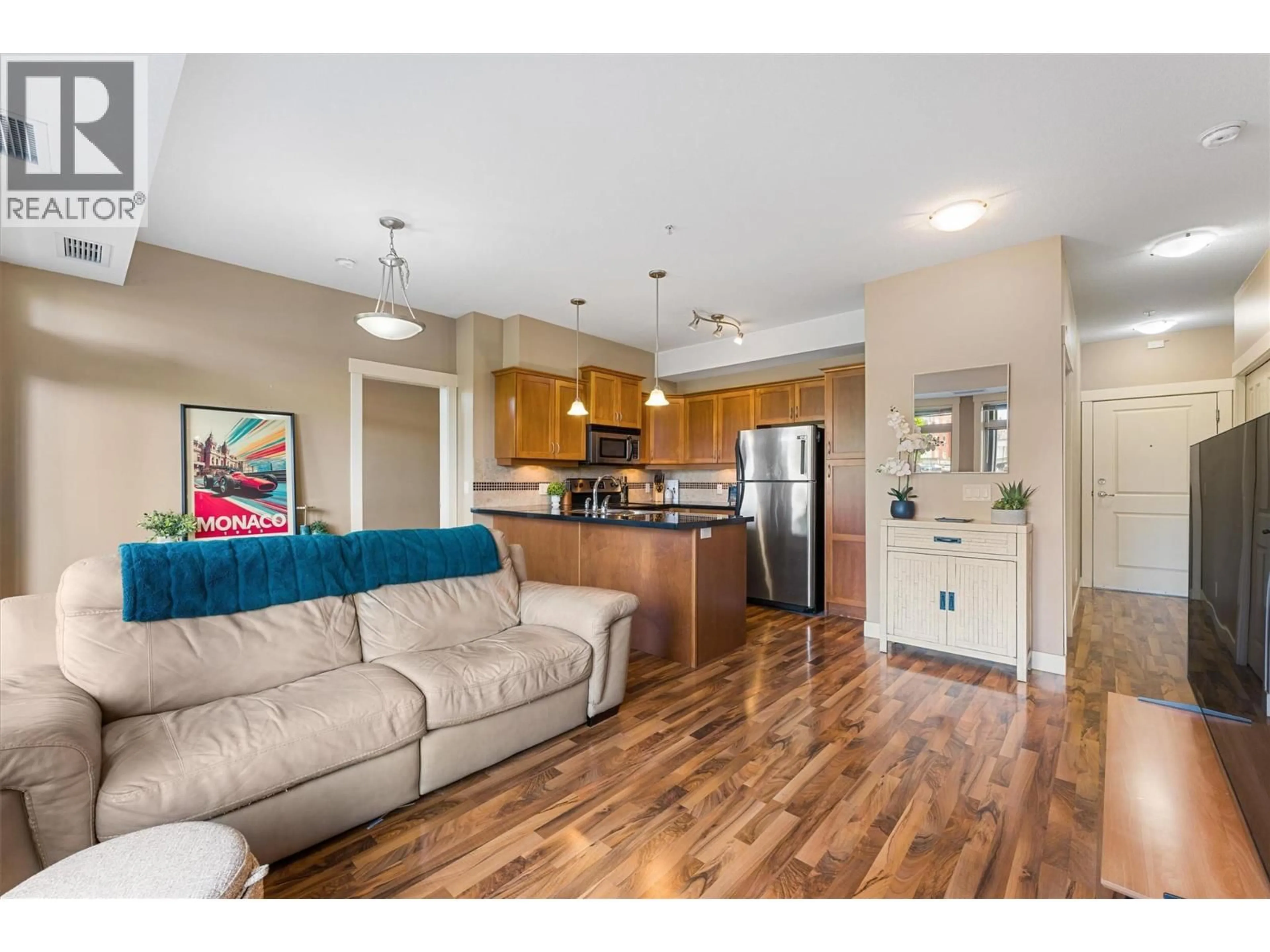 Open concept kitchen, wood/laminate floor for 112 - 3533 CARRINGTON ROAD, West Kelowna British Columbia V4T2Z9