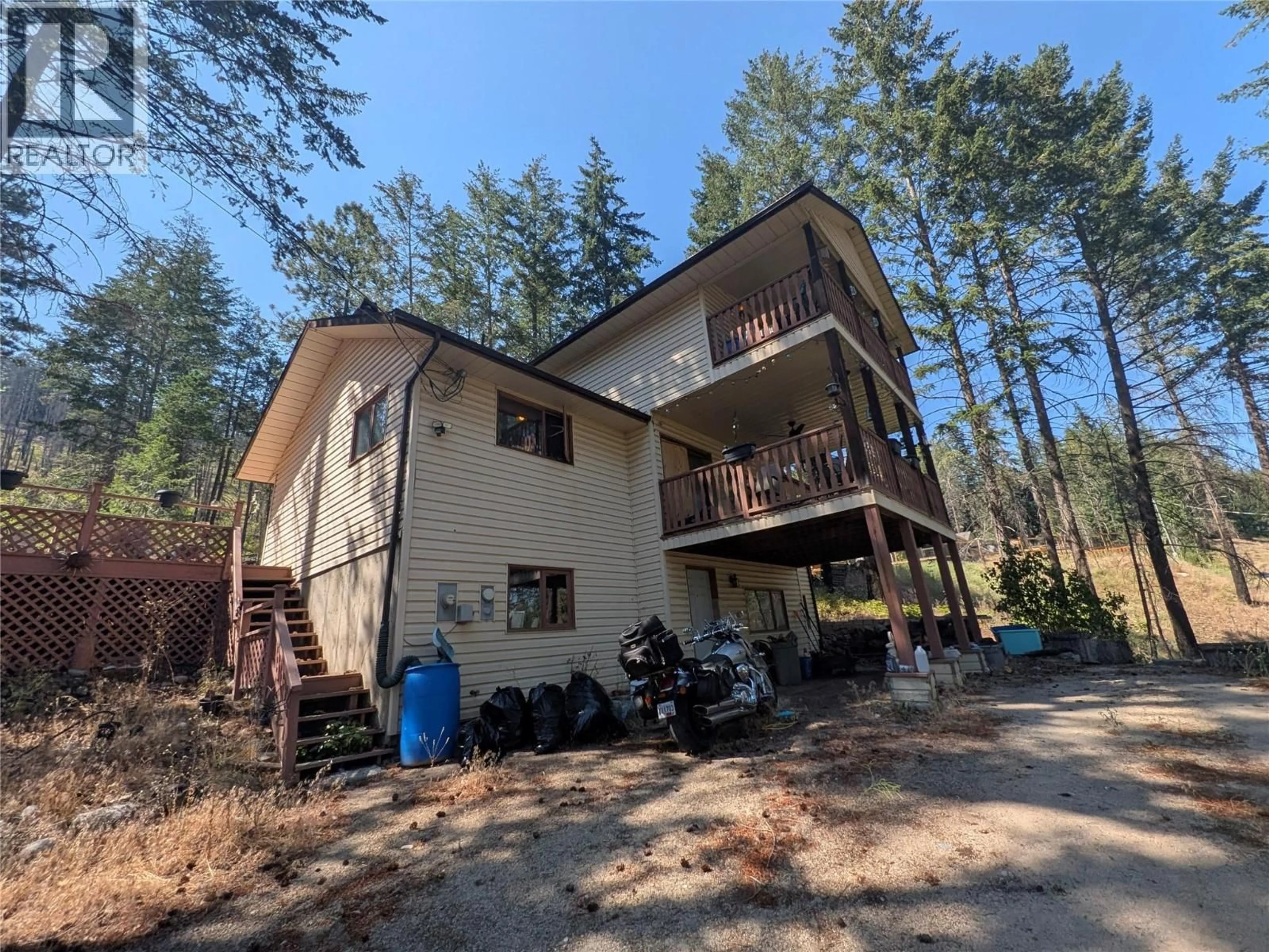 A pic from outside/outdoor area/front of a property/back of a property/a pic from drone, unknown for 9456 HOUGHTON ROAD, Vernon British Columbia V1H2C9
