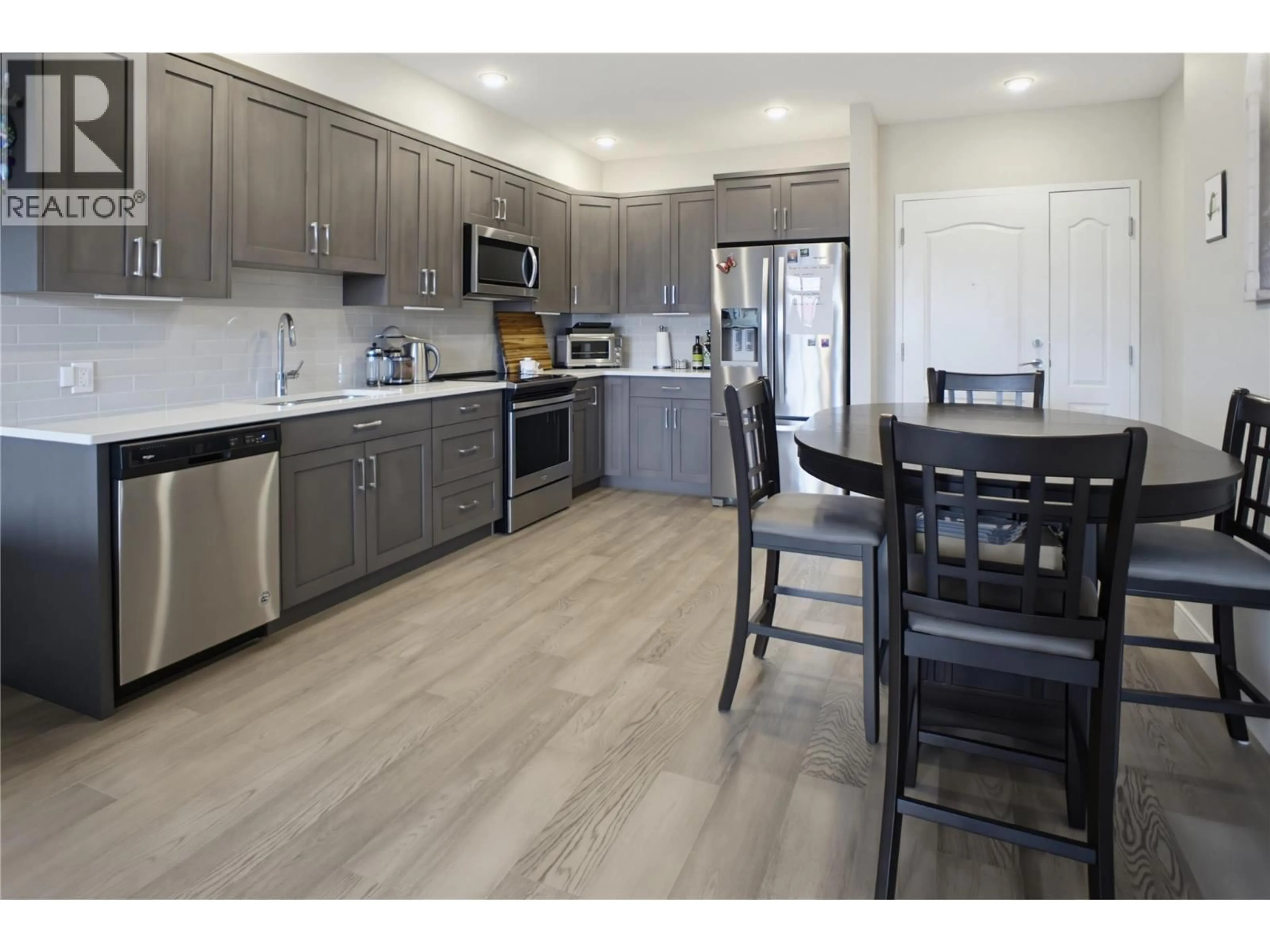 Open concept kitchen, wood/laminate floor for 205 - 568 LORNE STREET, Kamloops British Columbia V2C1W3