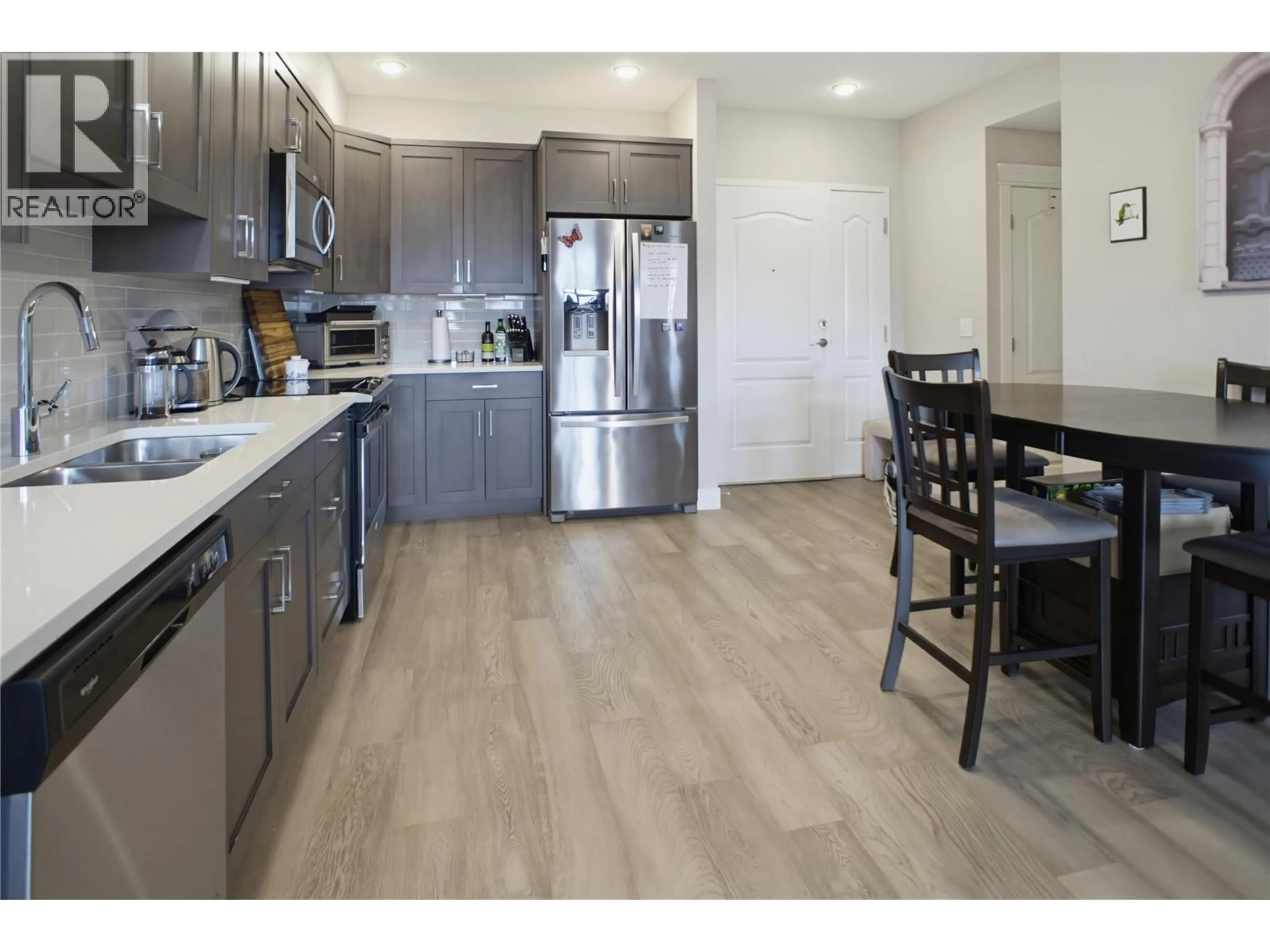 Open concept kitchen, wood/laminate floor for 205 - 568 LORNE STREET, Kamloops British Columbia V2C1W3