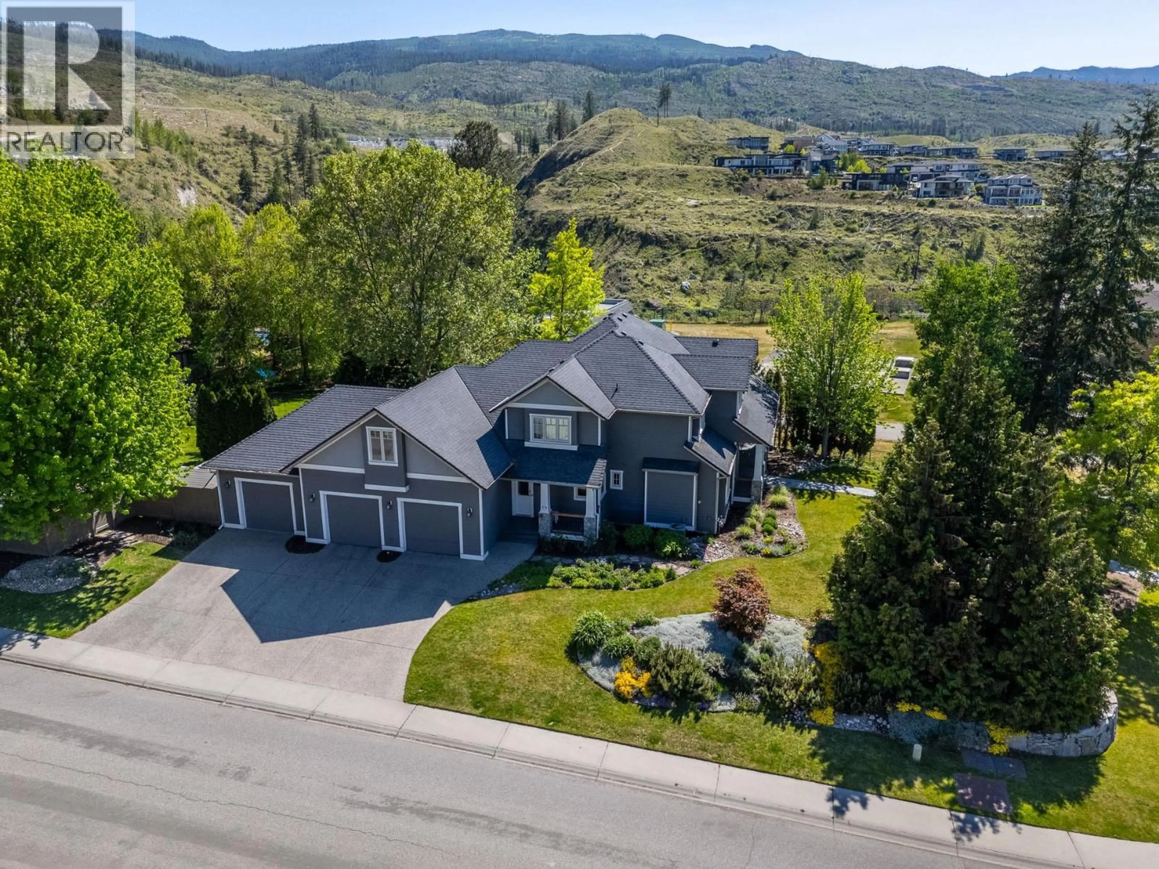 A pic from outside/outdoor area/front of a property/back of a property/a pic from drone, mountain view for 1717 CANYON VIEW COURT, Kelowna British Columbia V1W4A2