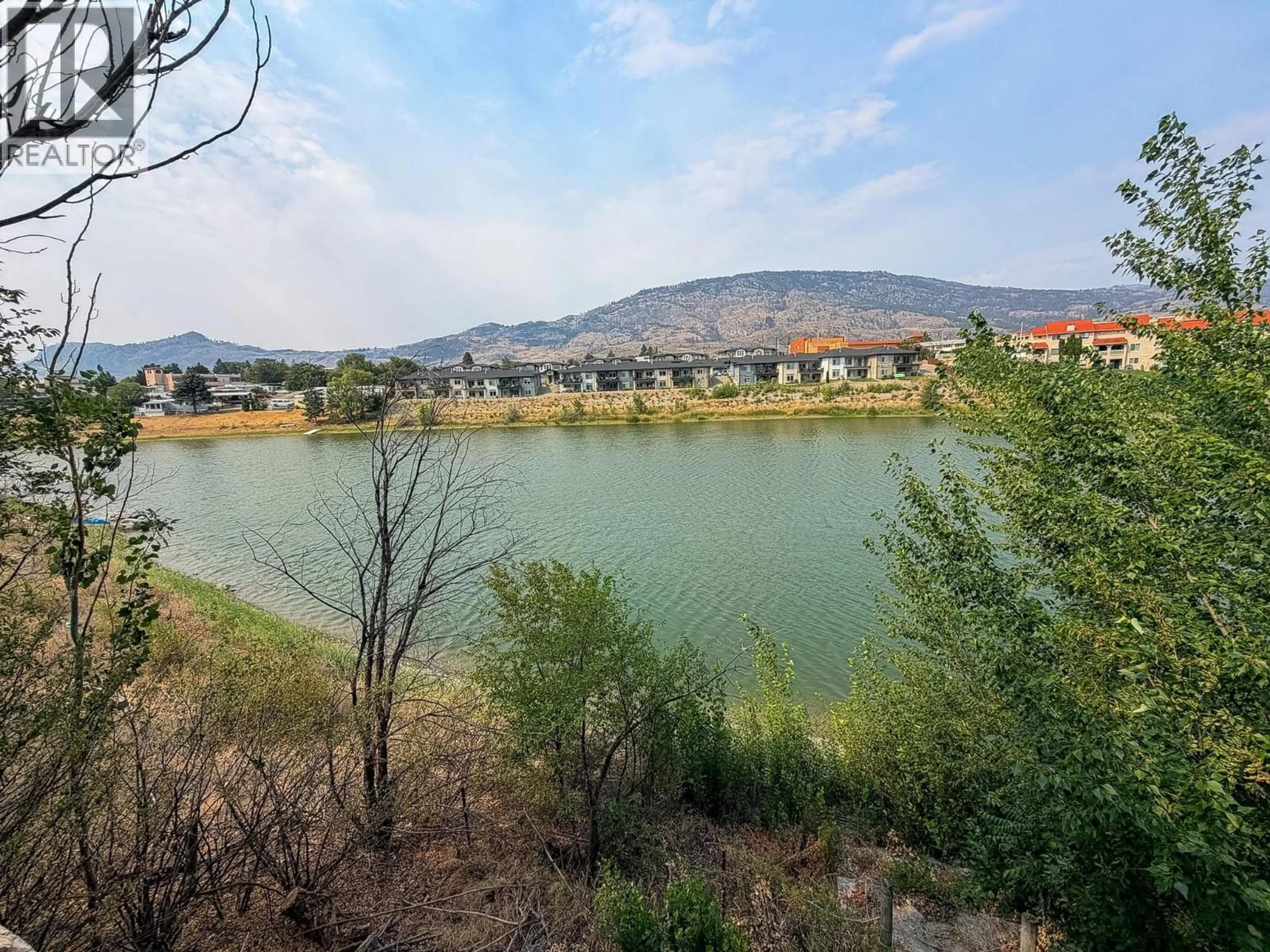 A pic from outside/outdoor area/front of a property/back of a property/a pic from drone, water/lake/river/ocean view for 8004 89TH STREET, Osoyoos British Columbia V0H1T1