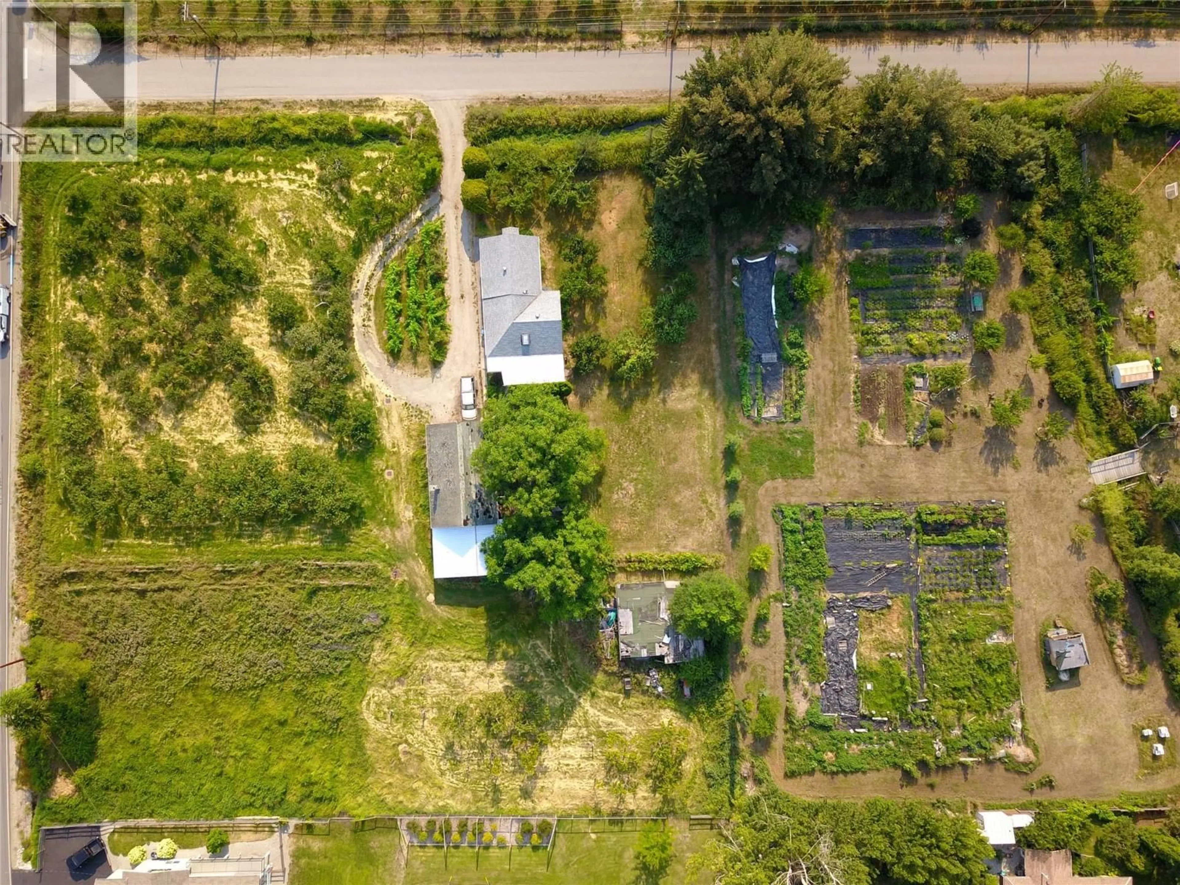 A pic from outside/outdoor area/front of a property/back of a property/a pic from drone, street for 10216 LUMSDEN AVENUE, Summerland British Columbia V0H1Z8